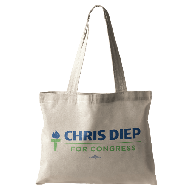 A beige tote bag with the text "CHRIS DIEP FOR CONGRESS" and a torch symbol in blue and green.
