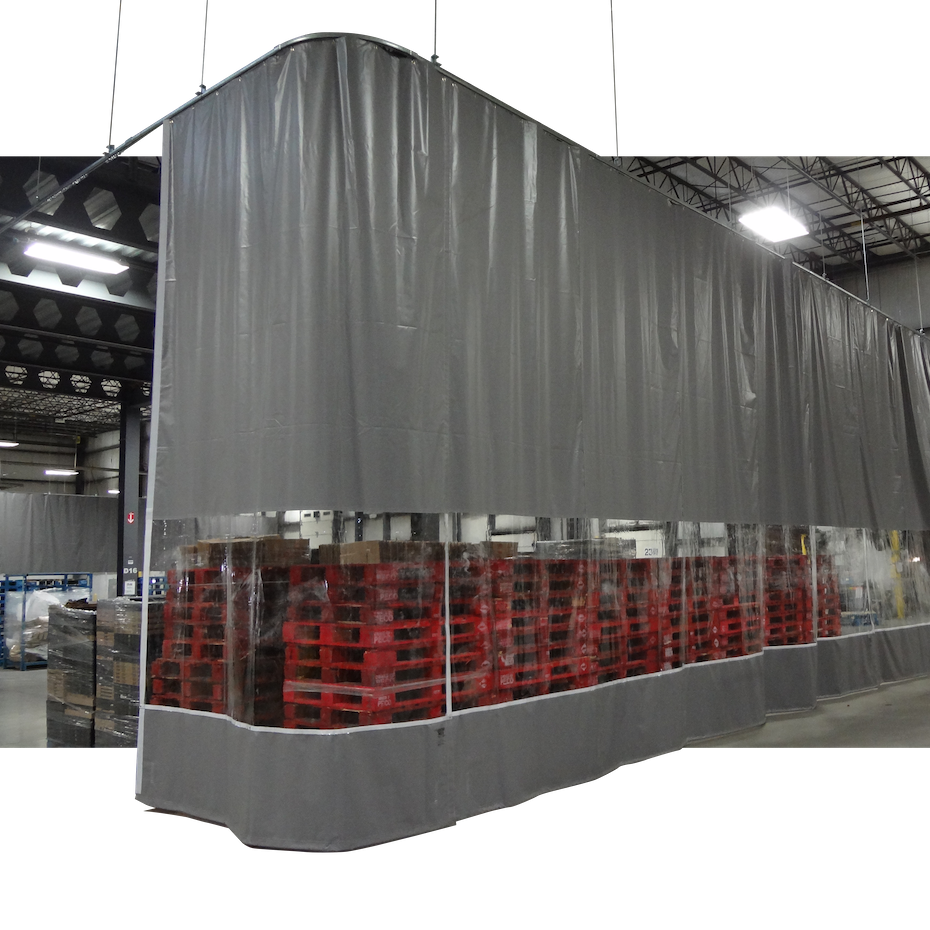Industrial storage tent with gray fabric walls and clear plastic lower section, containing stacked red pallets in a warehouse.