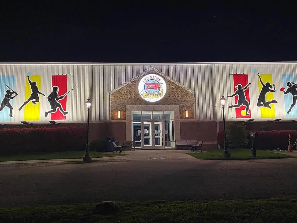 Large-scale mural for Lost Nation Sports Park. Set back from the main road, the facility required bold silhouettes designed to catch the attention of passing traffic from a distance.