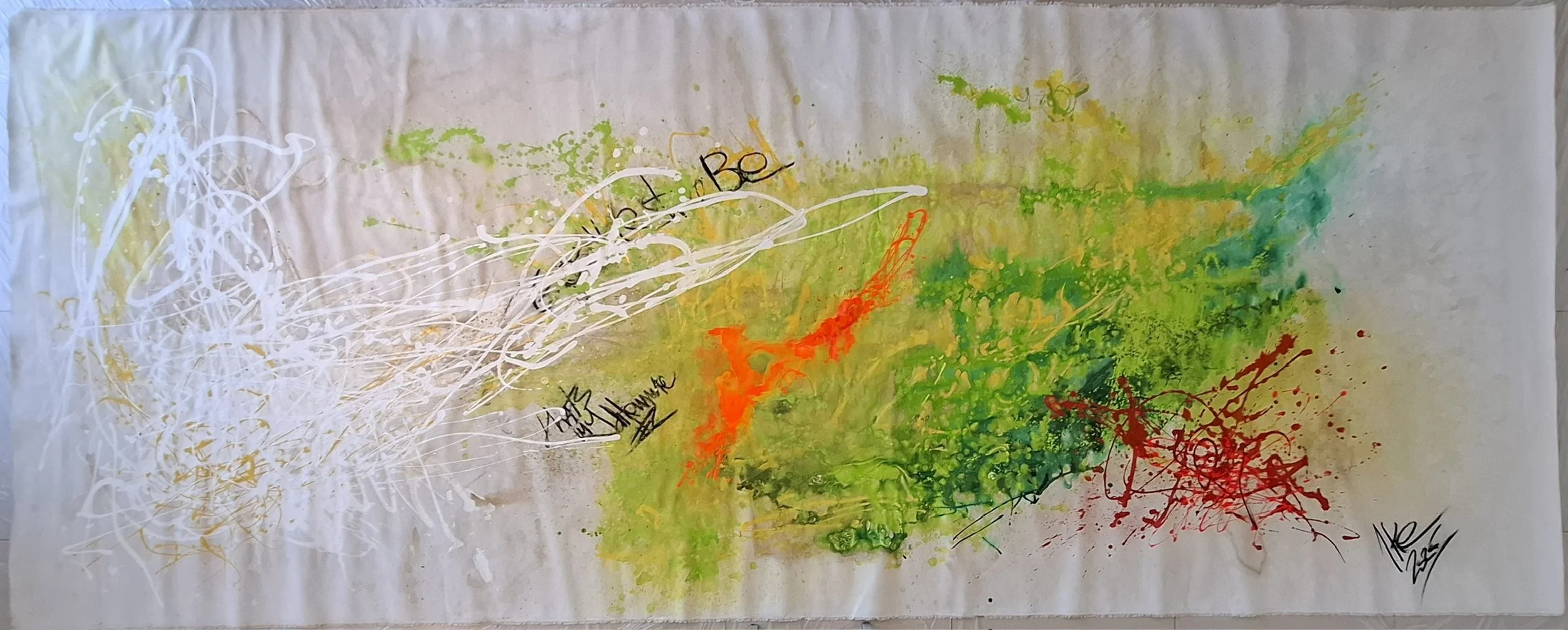 Abstract artwork with splashes of white, yellow, green, orange, and red paint on paper, including black handwritten text and signature.