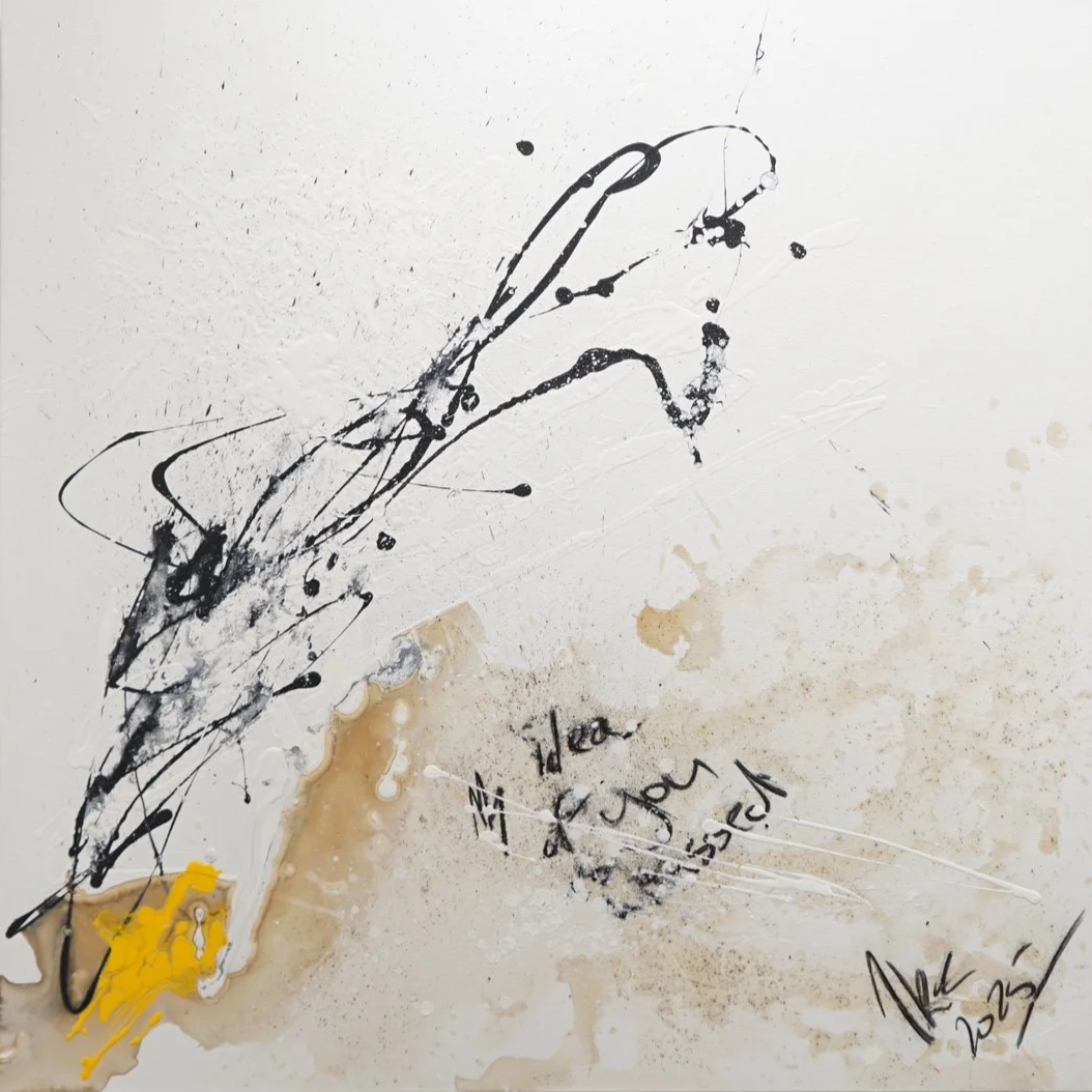 Abstract black ink splatters and lines on a white background, with some beige and yellow smudges, and handwritten words 'Idea of joy', along with signatures.
