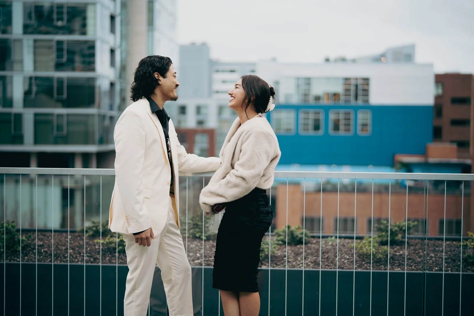  Engagement photography on the outside balcony at the Portland Art Museum with a view of Portland’s downtown 
