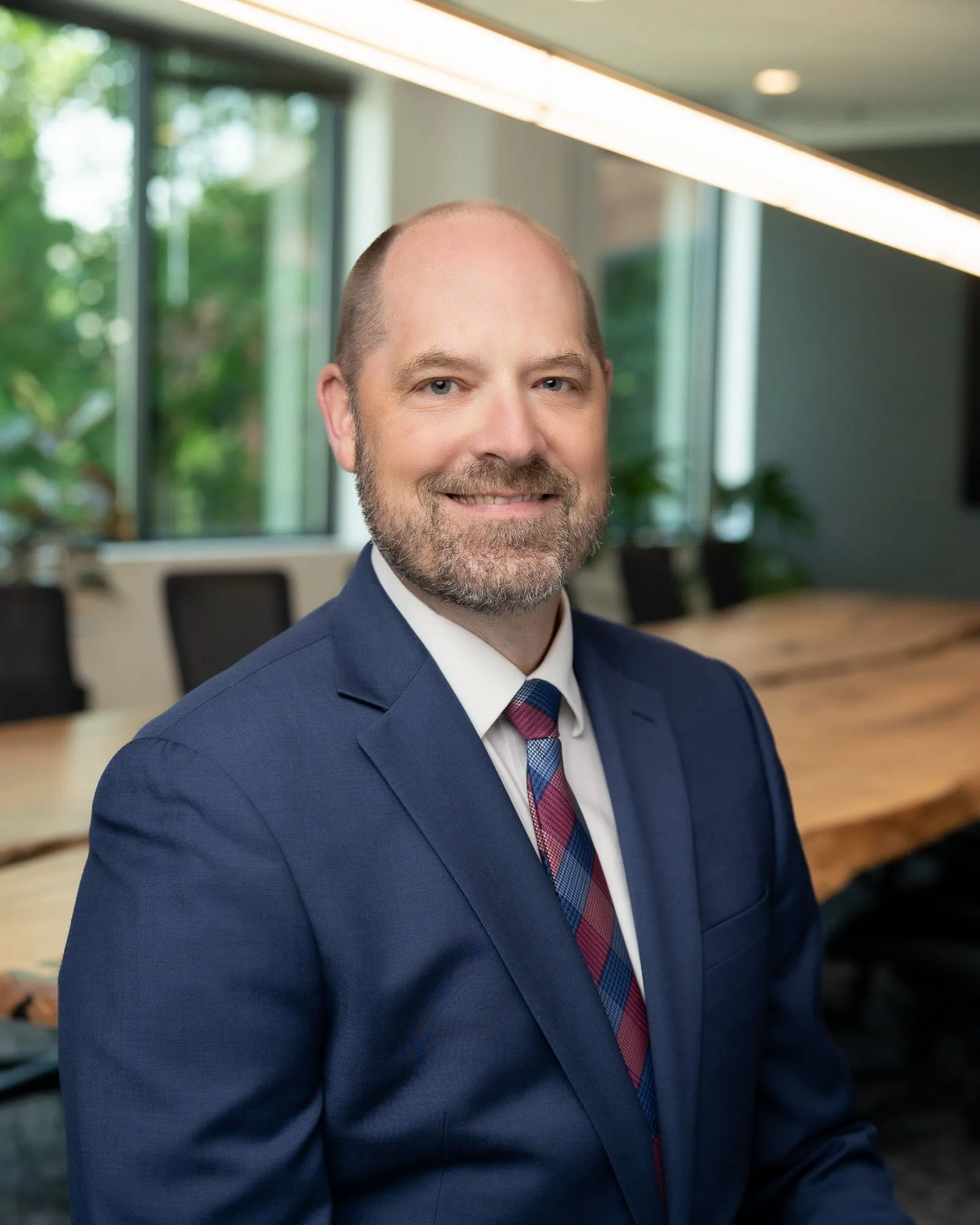  Professional lawyer in a navy suit and patterned tie 