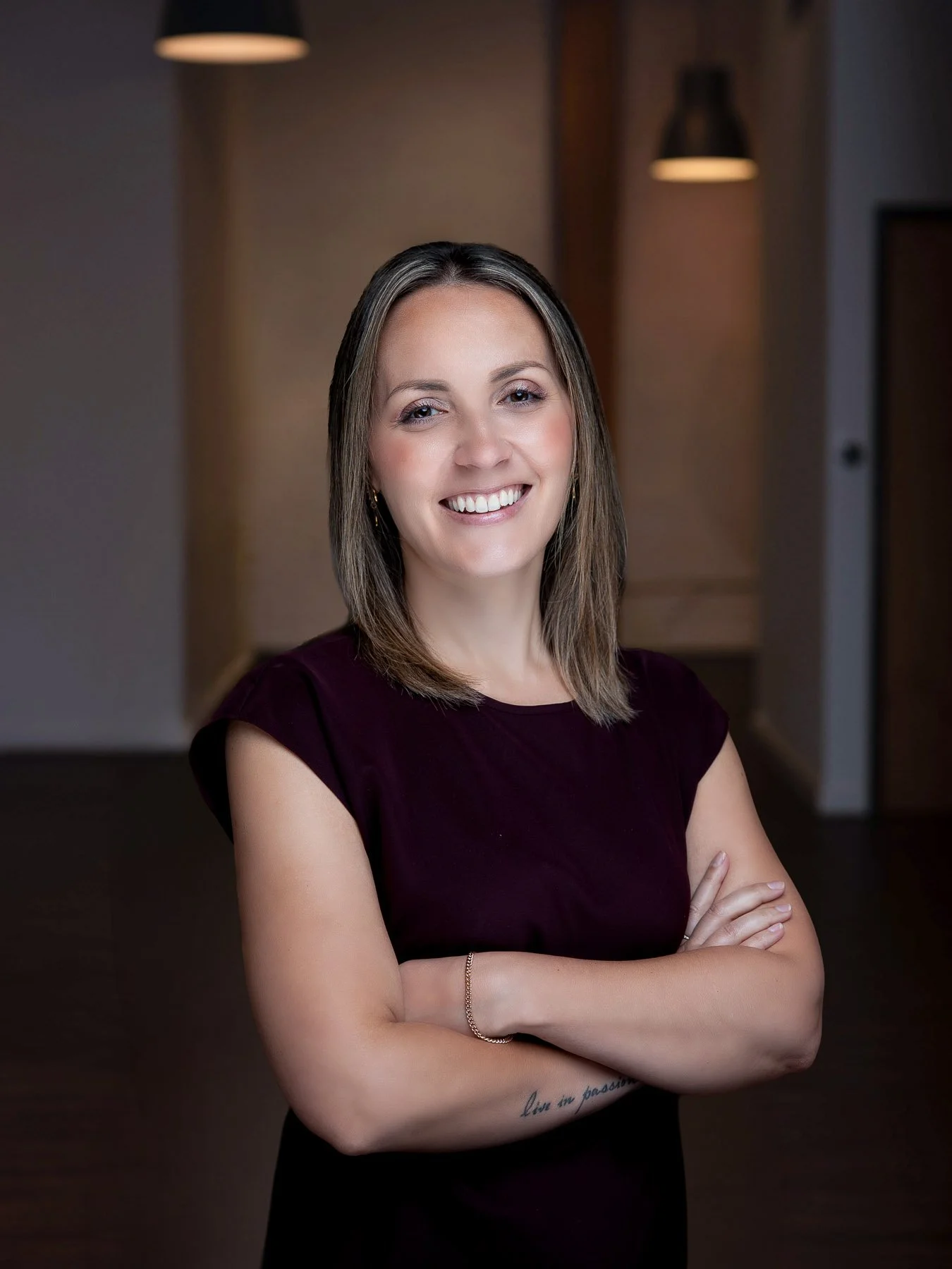  Smiling female realtor in empty company office 