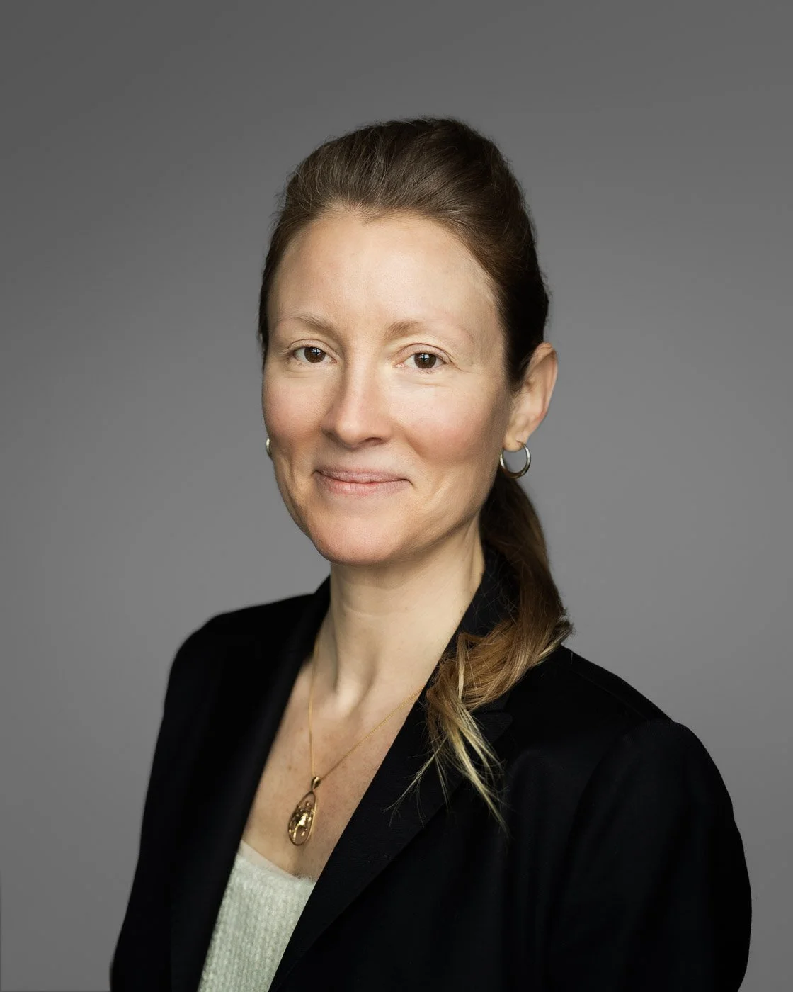 Natural light headshot of professional woman