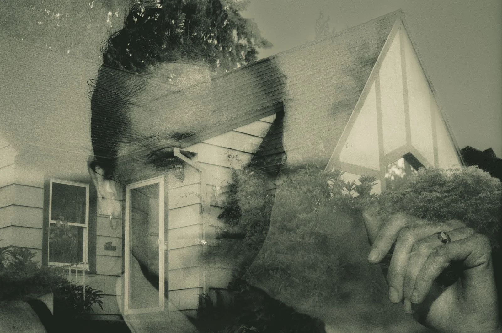 Double exposure portrait of a house in Portland and a woman's face