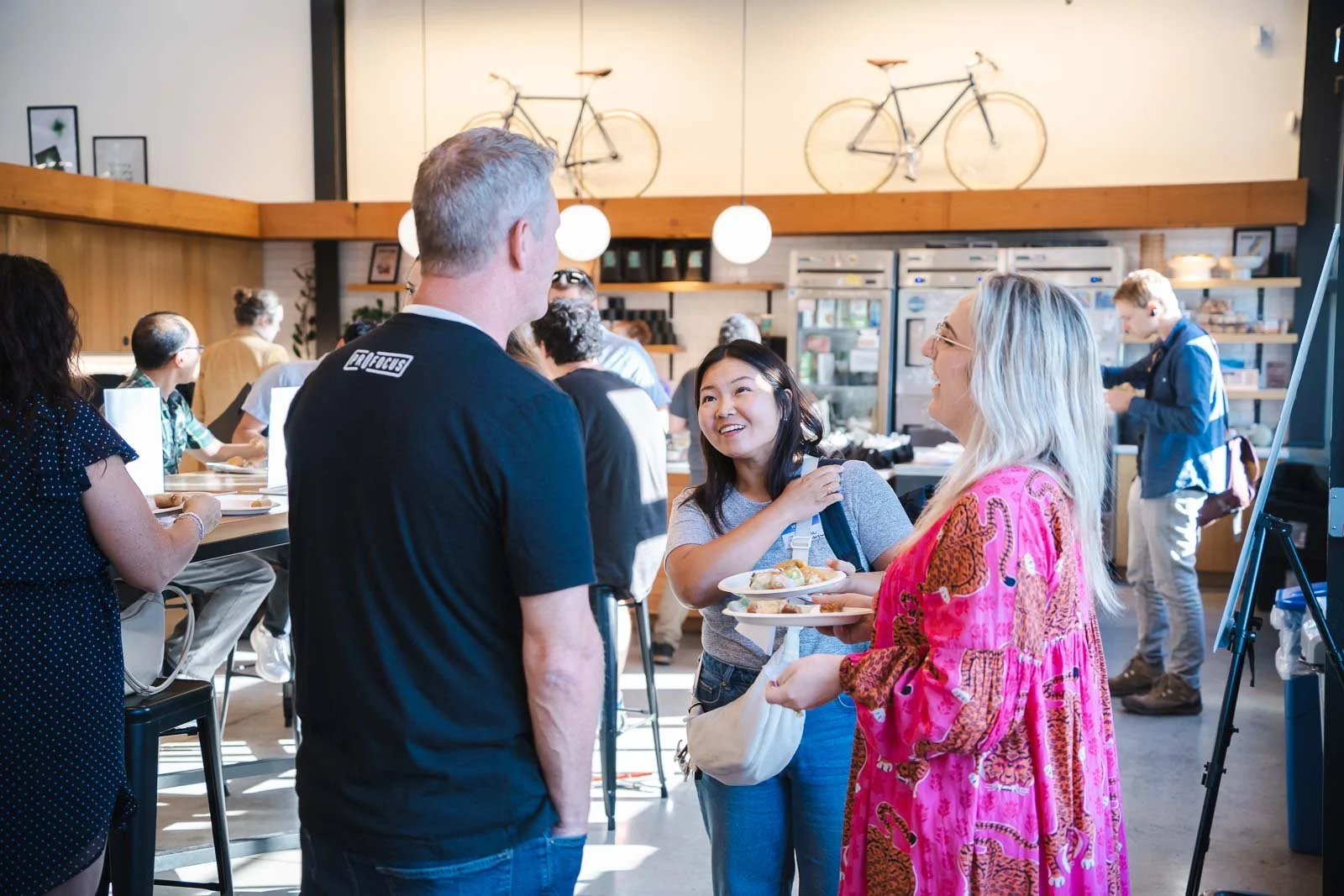 People talking and smiling in the event space Kiln in Portland