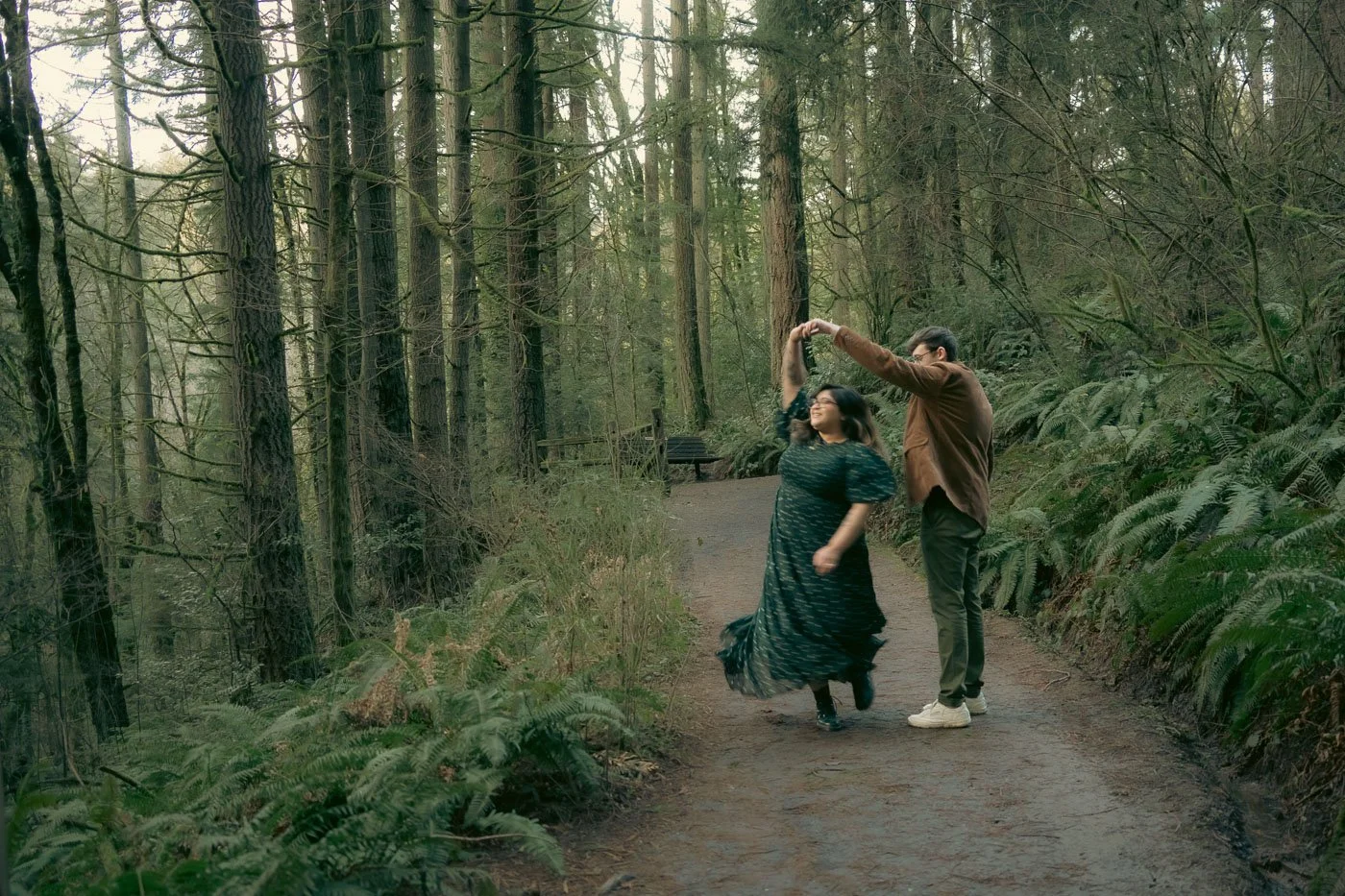 A couple dancing in the forest of Hoyt Arboretum