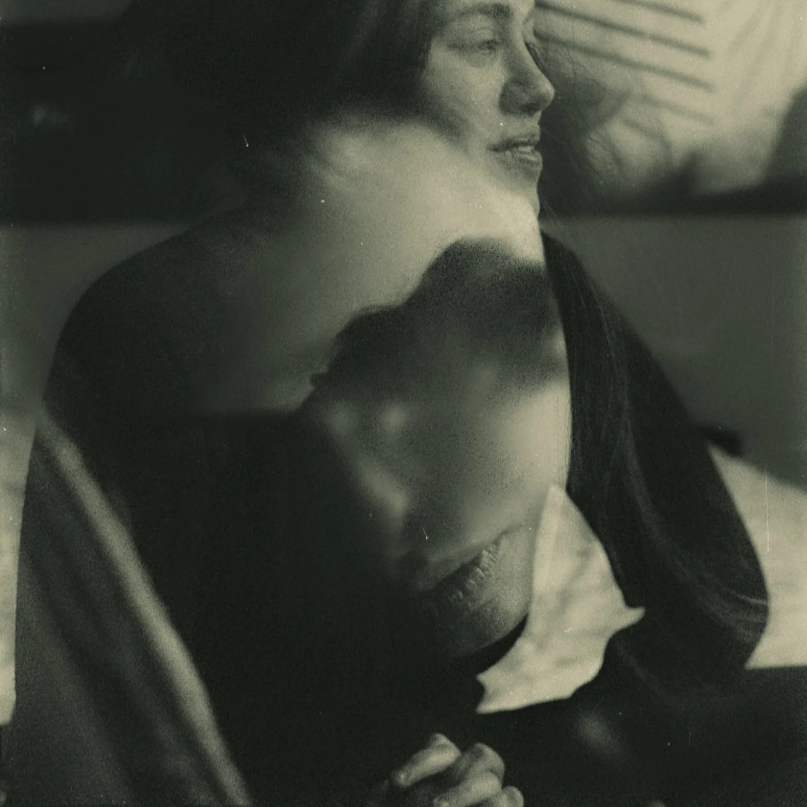 Two intertwined portraits of a girl in her bedroom