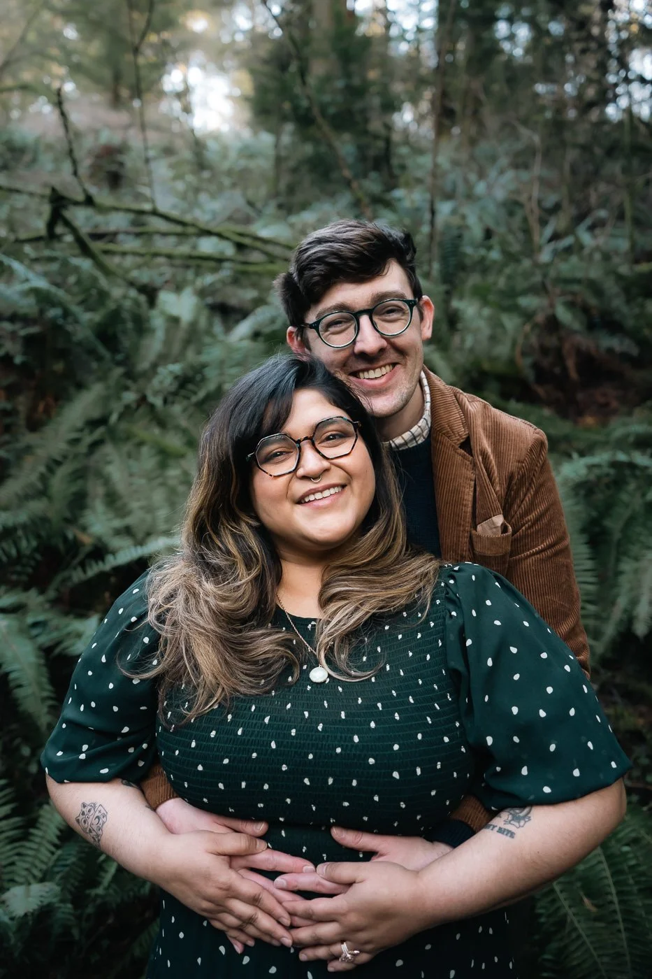 A smiling couple in the forest of Hoyt Arboretum