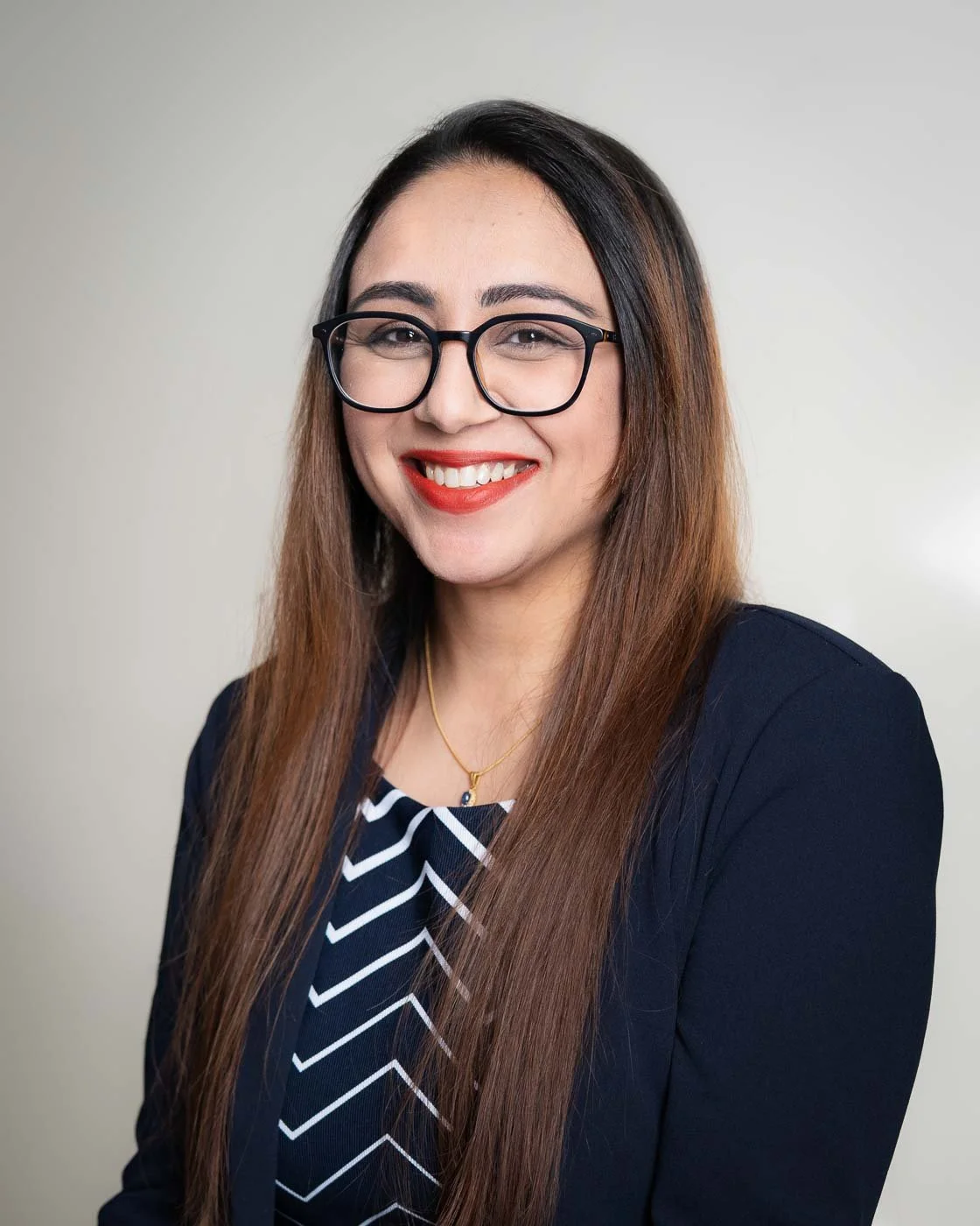 Headshot of a woman with glasses