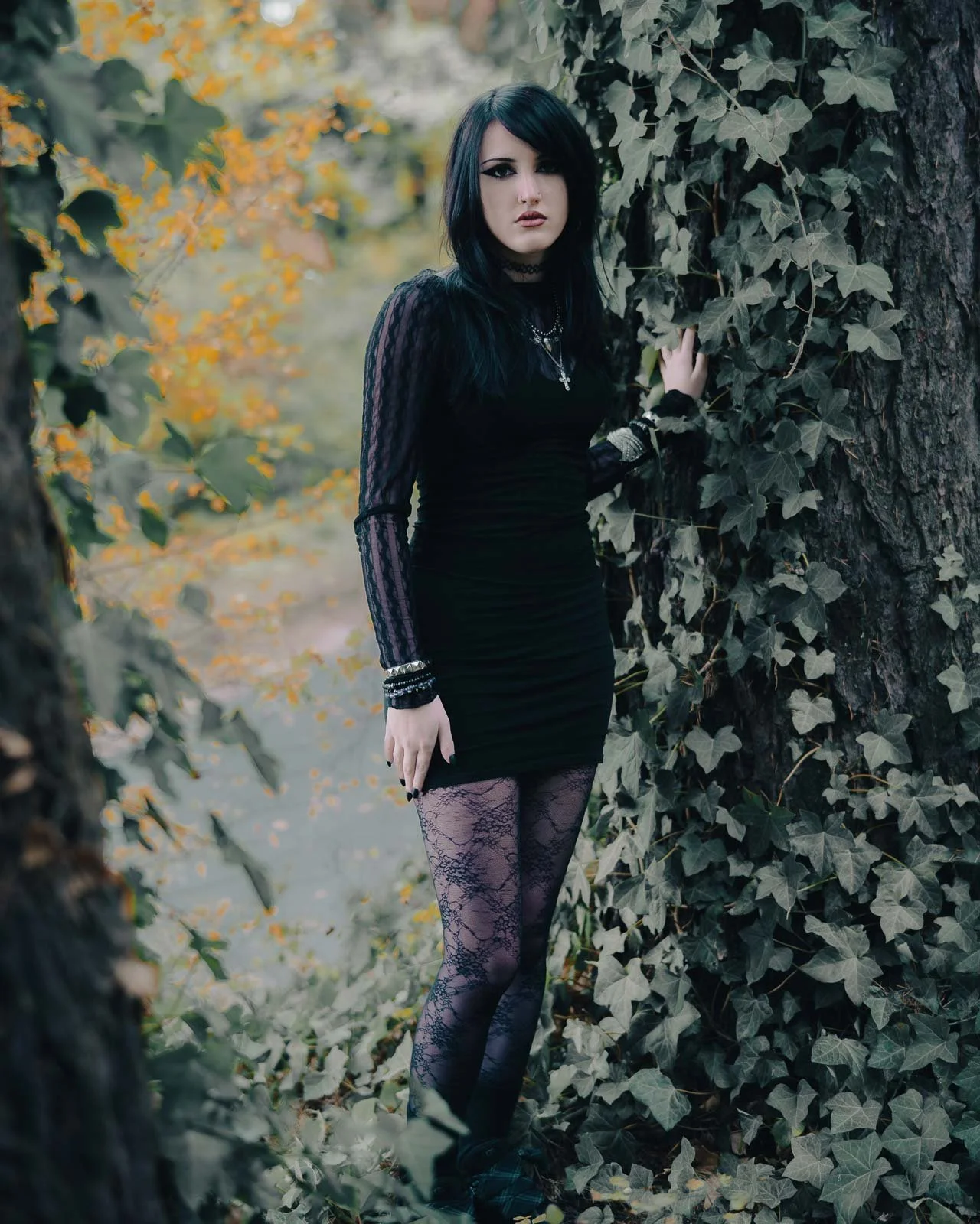 Gothic high school senior leaning on an ivy covered tree at Mt Tabor