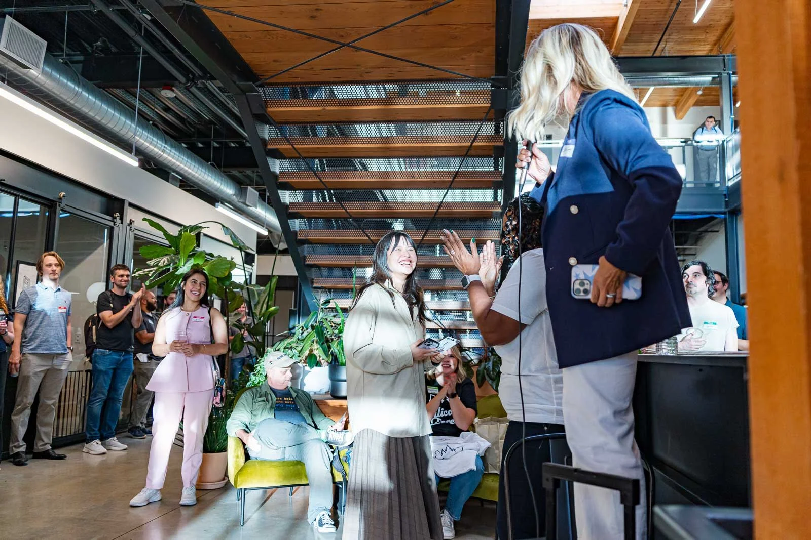 Raffle prizes being given away to a smiling woman