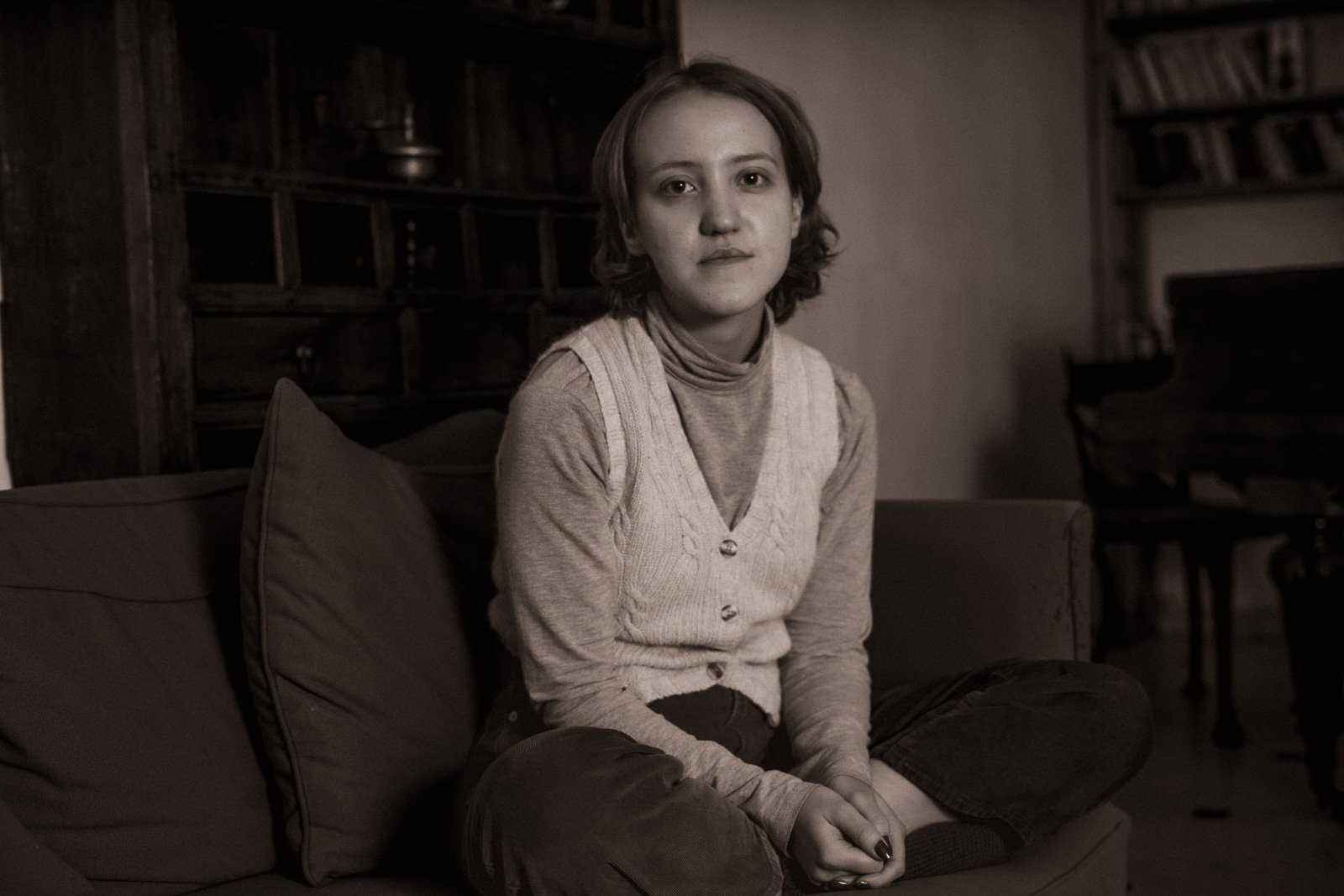 A timeless looking girl posing for a portrait in her home