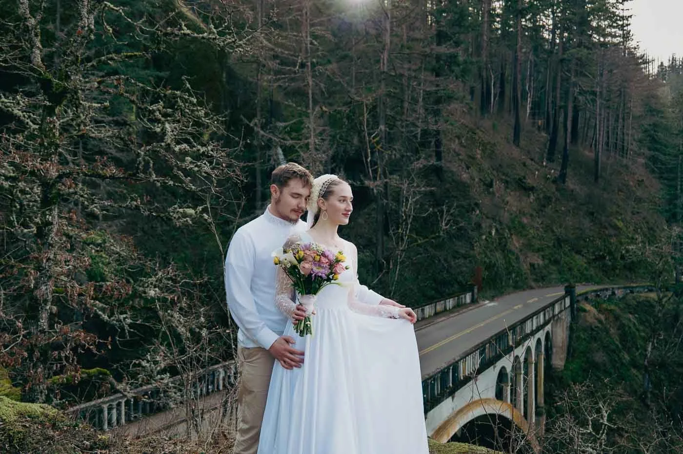 Matching bride and groom above a bridge near Latourell Falls in the Columbia River Gorge