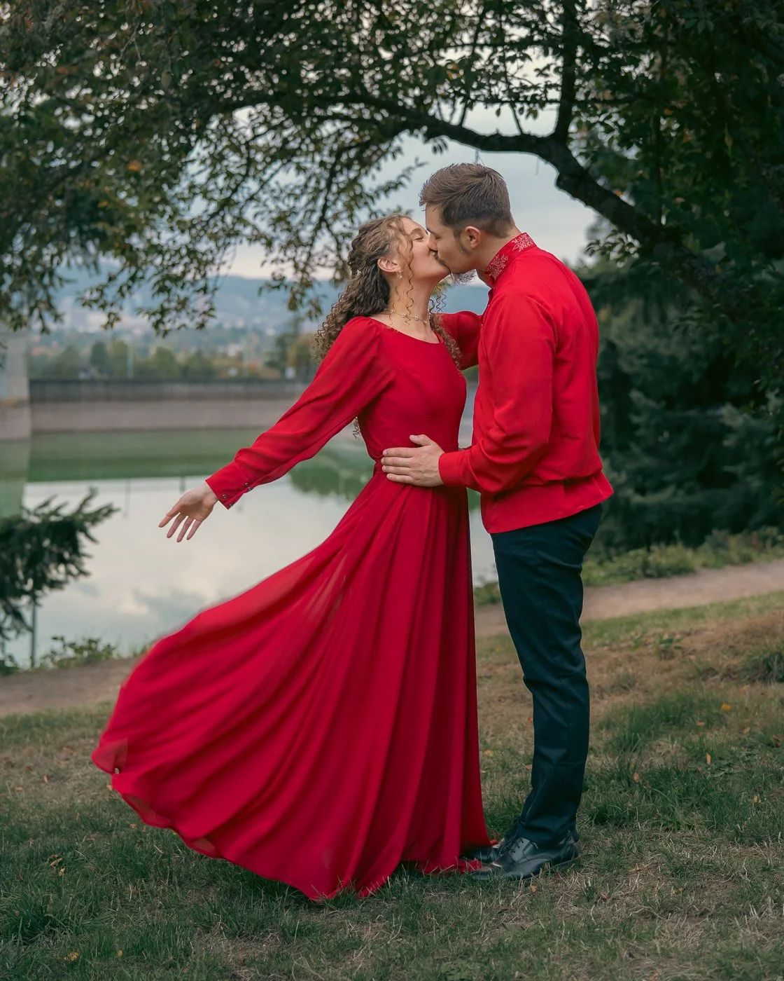 Couple eloping in matching red outfits at Mt Tabor