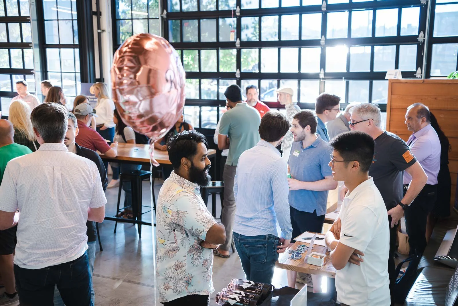 Group of vendors are attendees in the Kiln Building in Portland