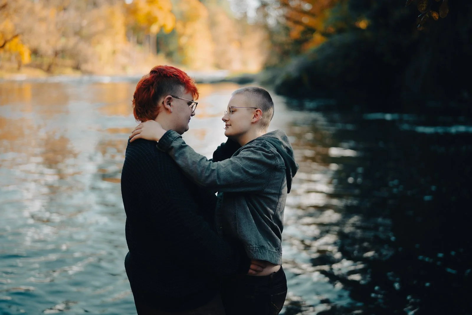 A high school couple holding each other in front of the Tualatin River