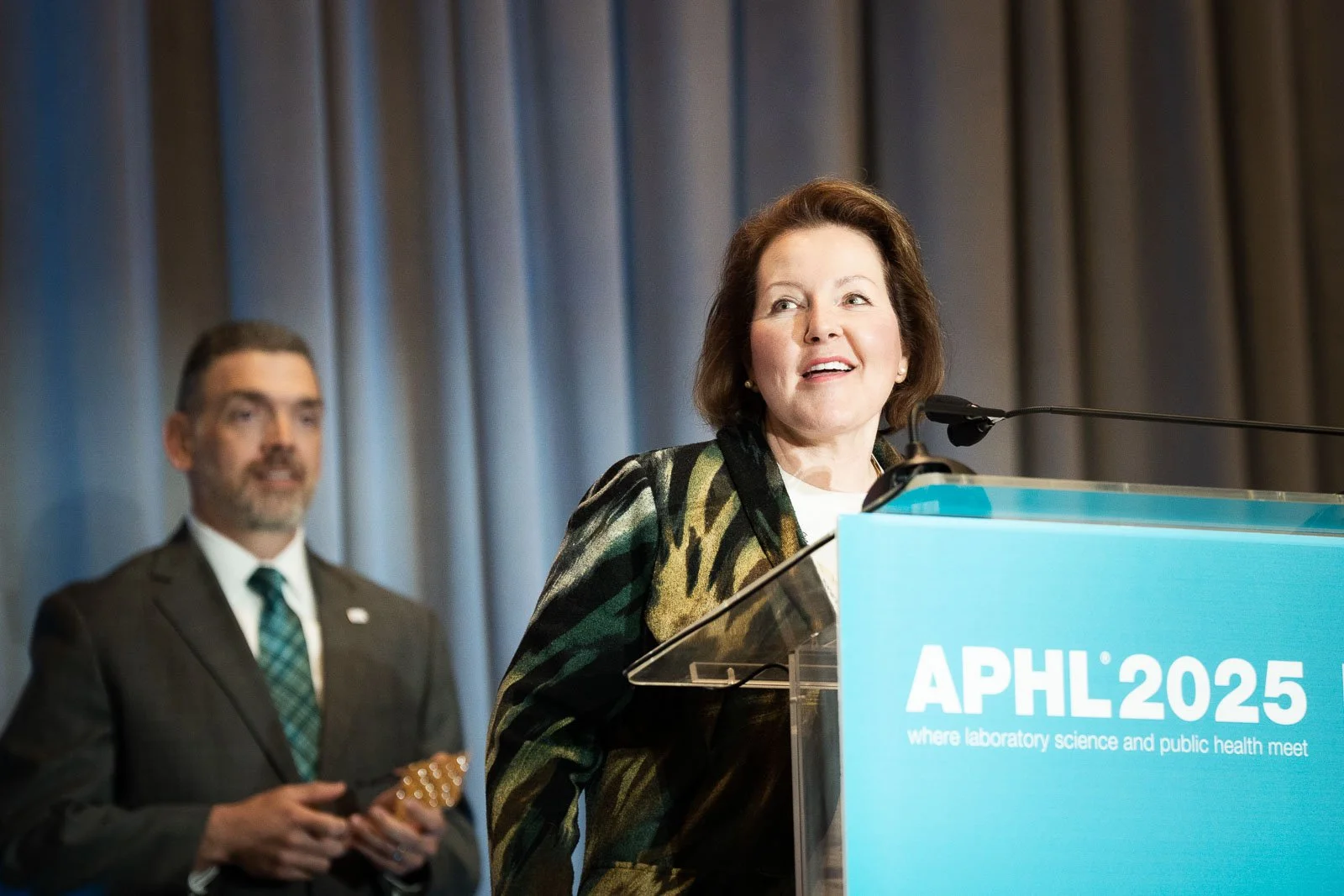 APHL speaker on stage at the Portland Expo Center