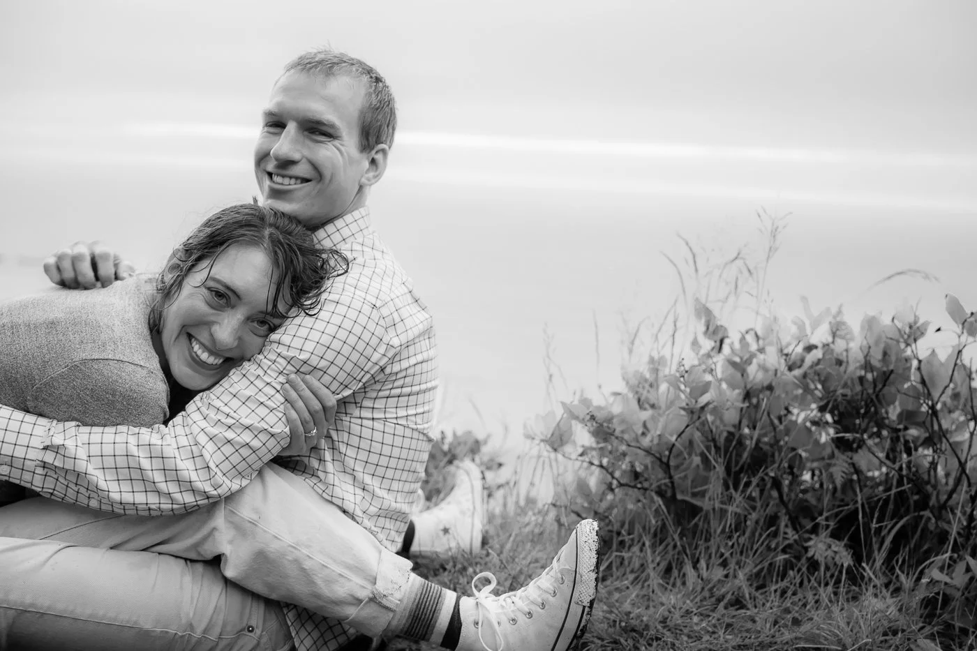 A couple laughing while embracing