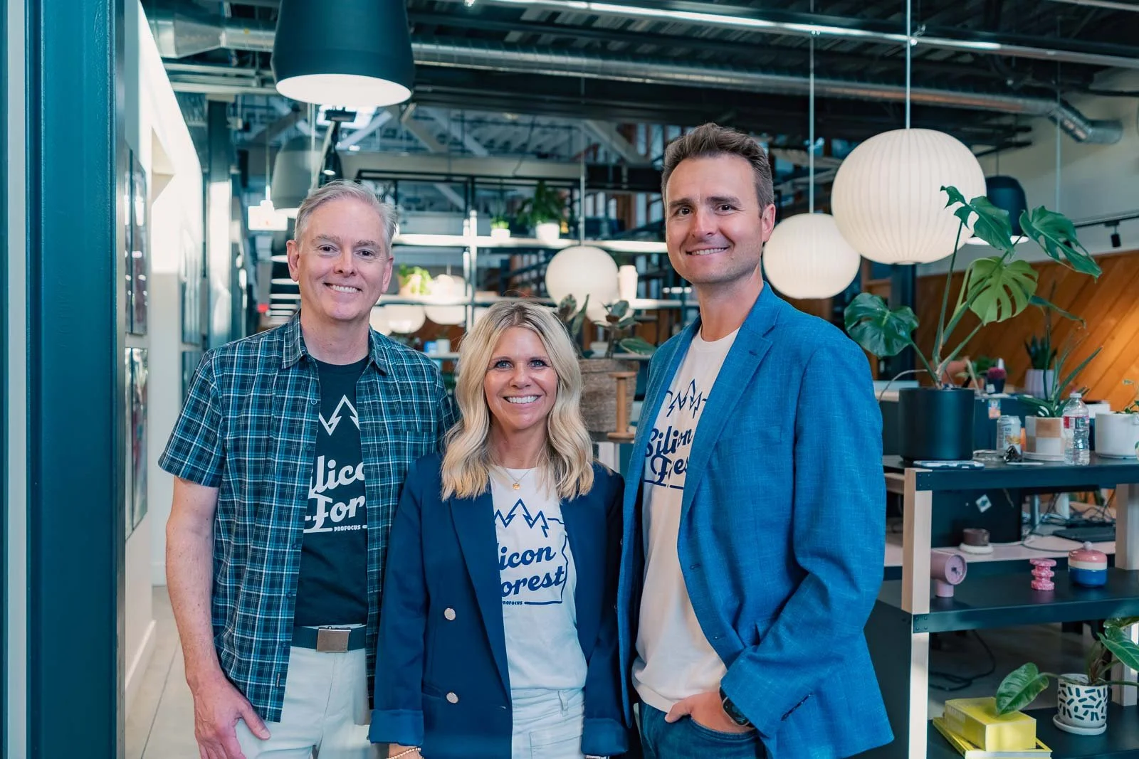 Smiling leadership team for Pro Focus