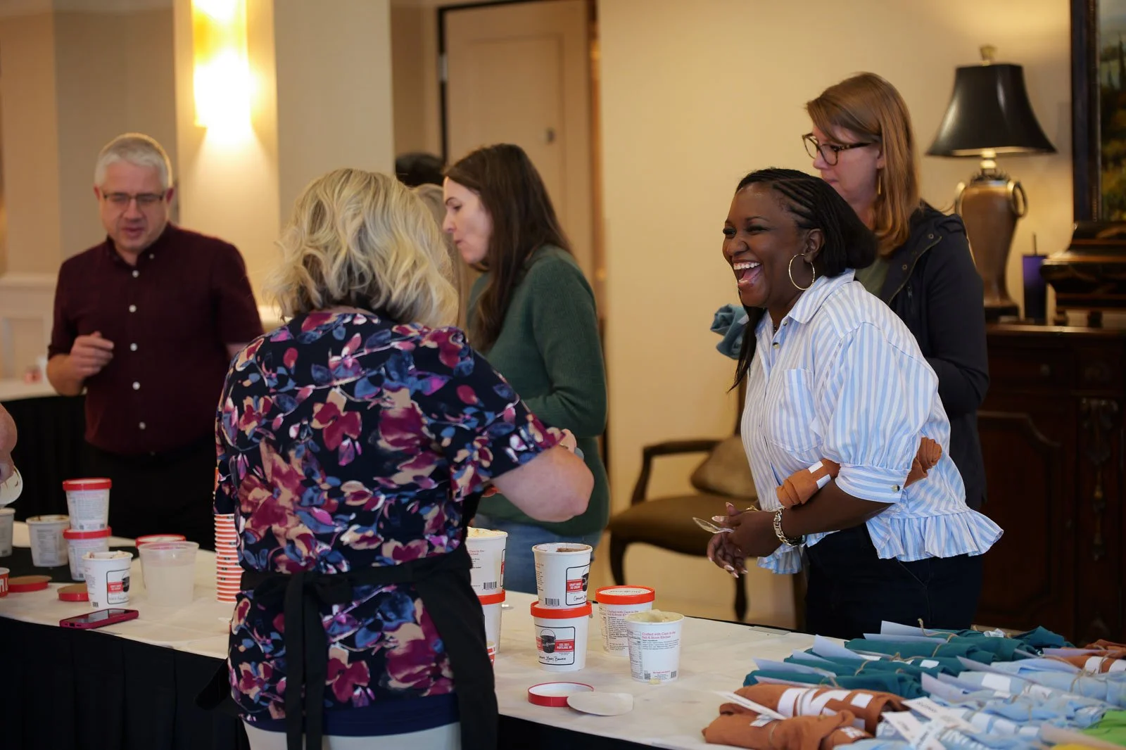 A smiling group of people getting icecream at the Roundtree conference
