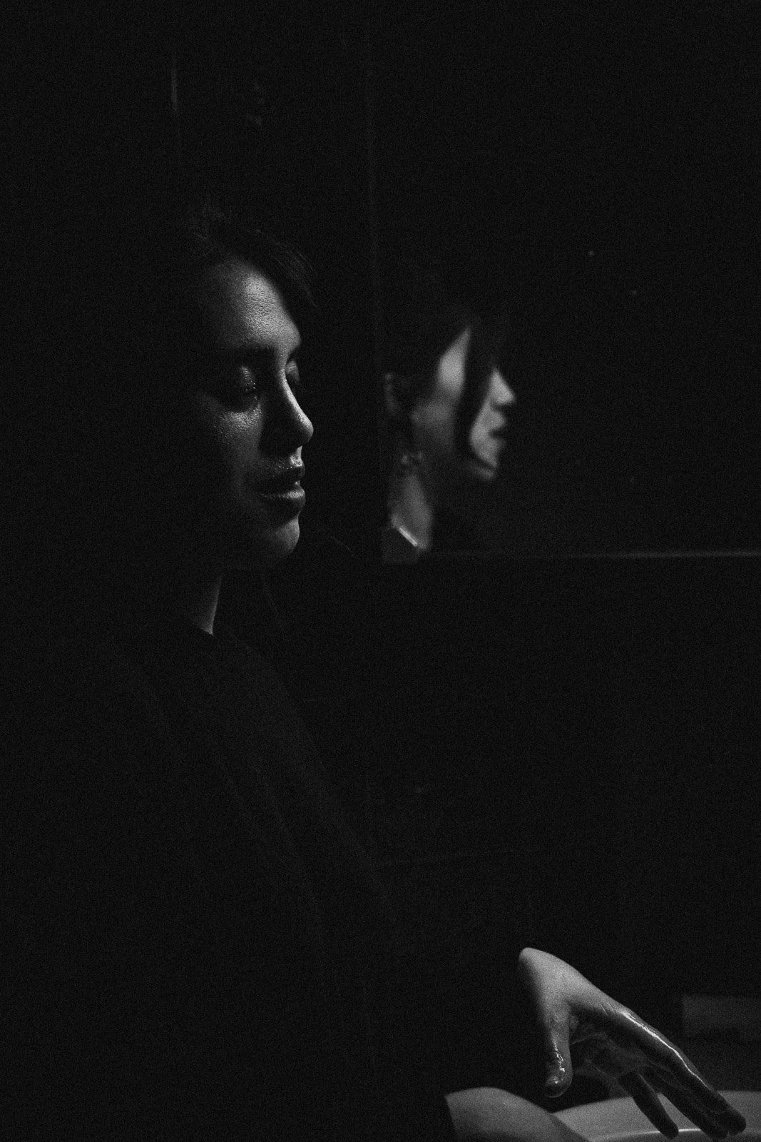 A girl and her reflection in the mirror