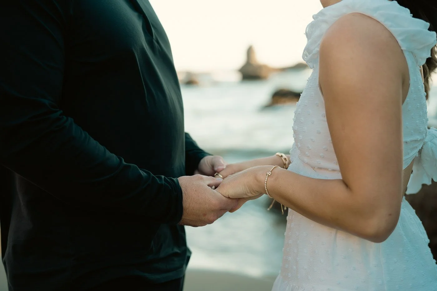 Oregon coast engagement photography with a couple holding hands