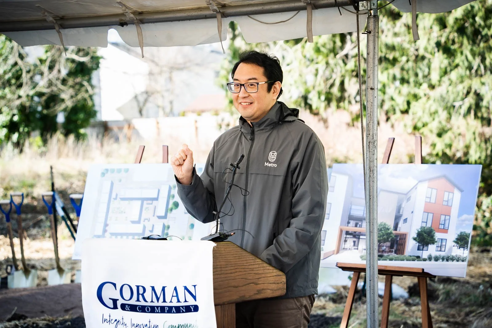 A man giving a speech at the ribbon ceremony for Gorman and Company