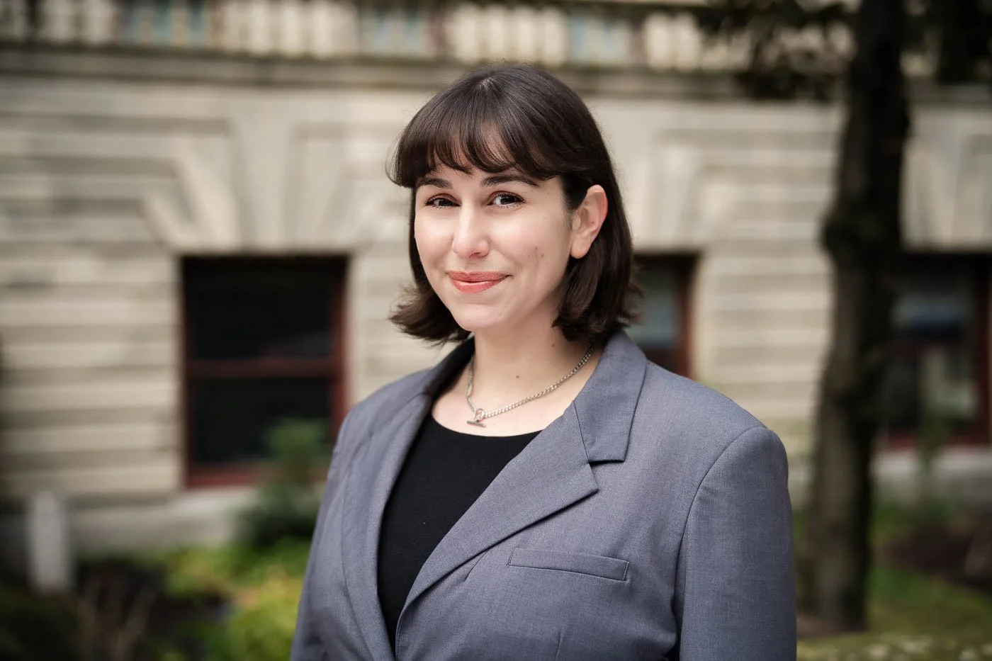 Outdoor headshot of a female lawyer in downtown Portland