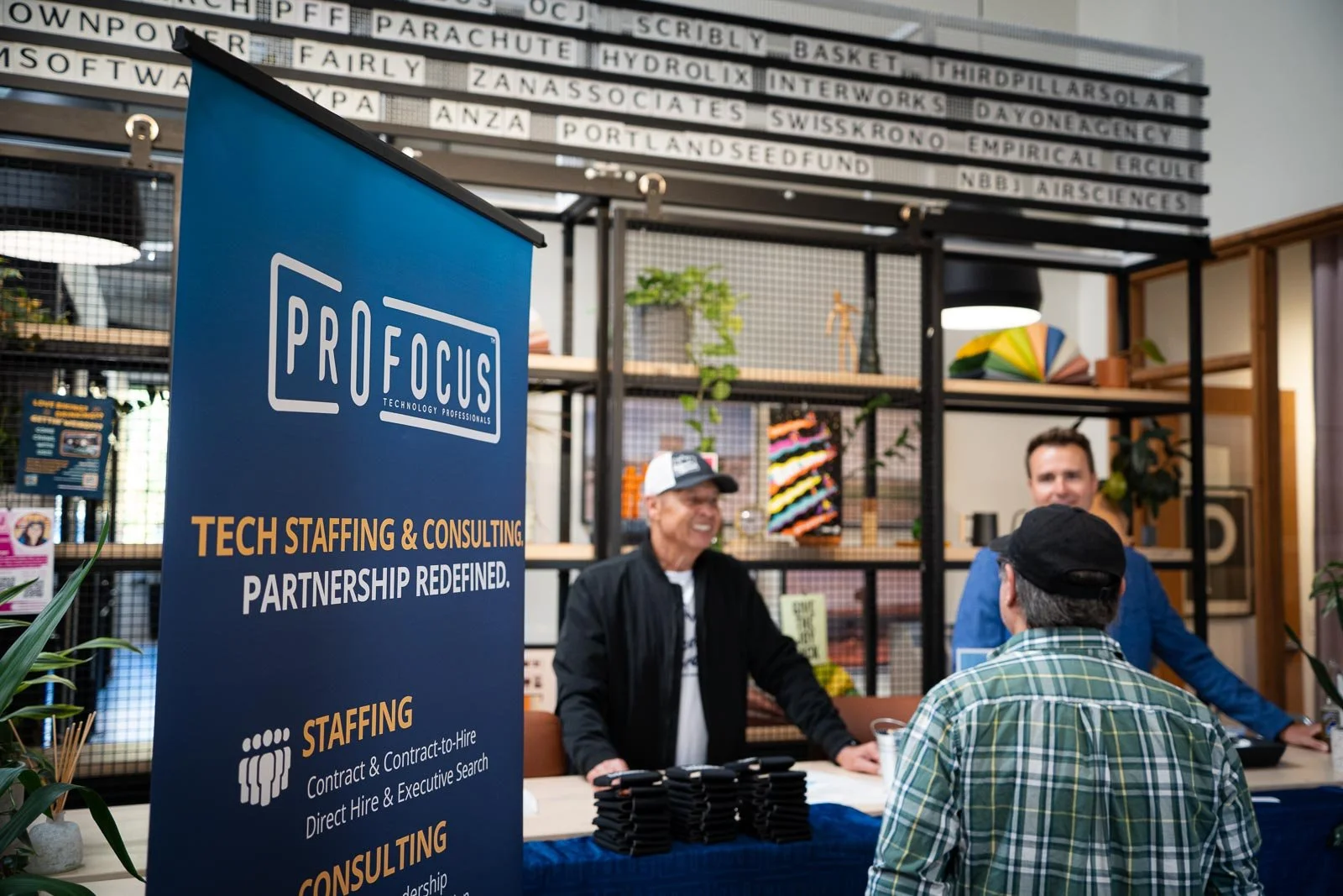 People being checked in for the Pro Focus event at Kiln in Portland