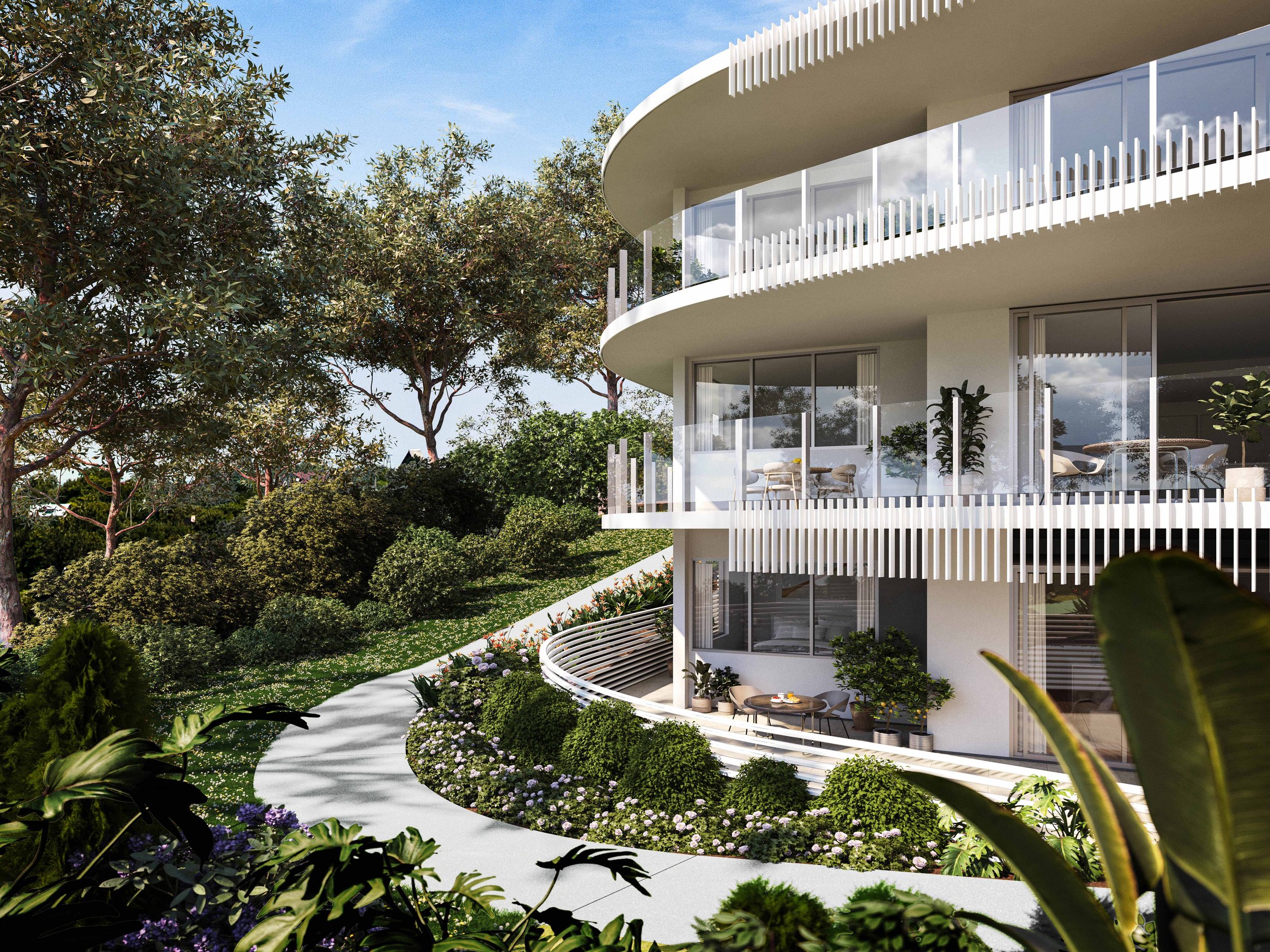 Modern multi-story building with curved balconies and glass walls, surrounded by lush greenery and trees, under a clear blue sky.