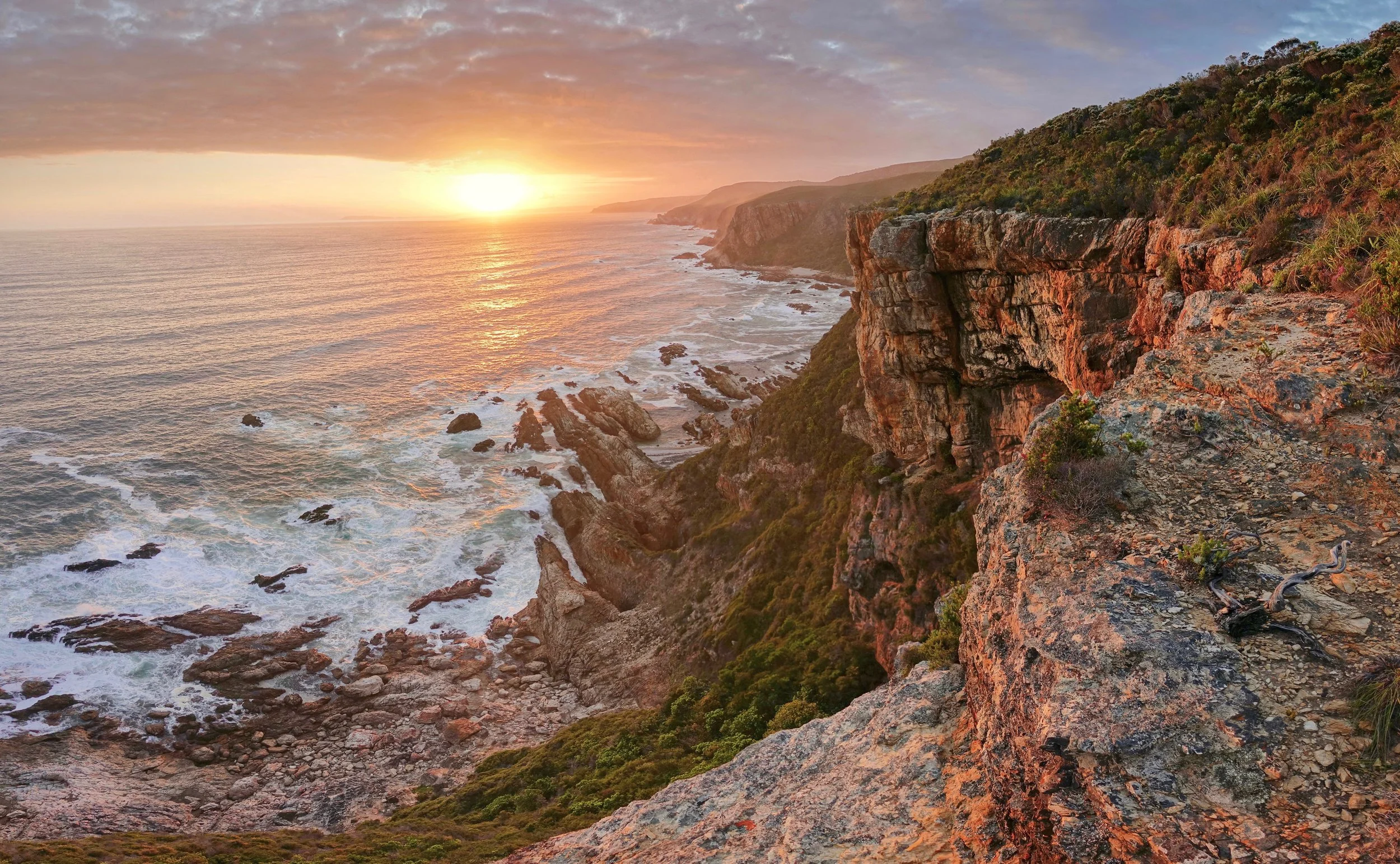 Sunset over the rocks on the Tsitsikamma coast on the Otter trail hike in South Africa