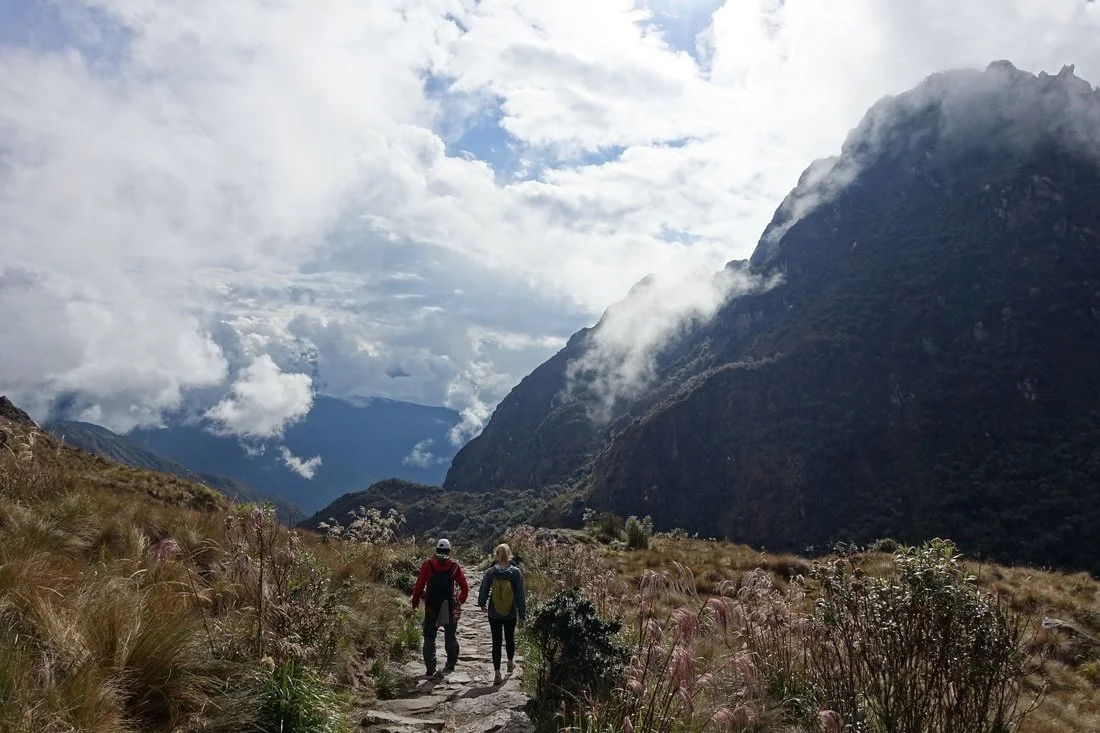 Hiking down Runcuraccay pass on Inca trail in Peru