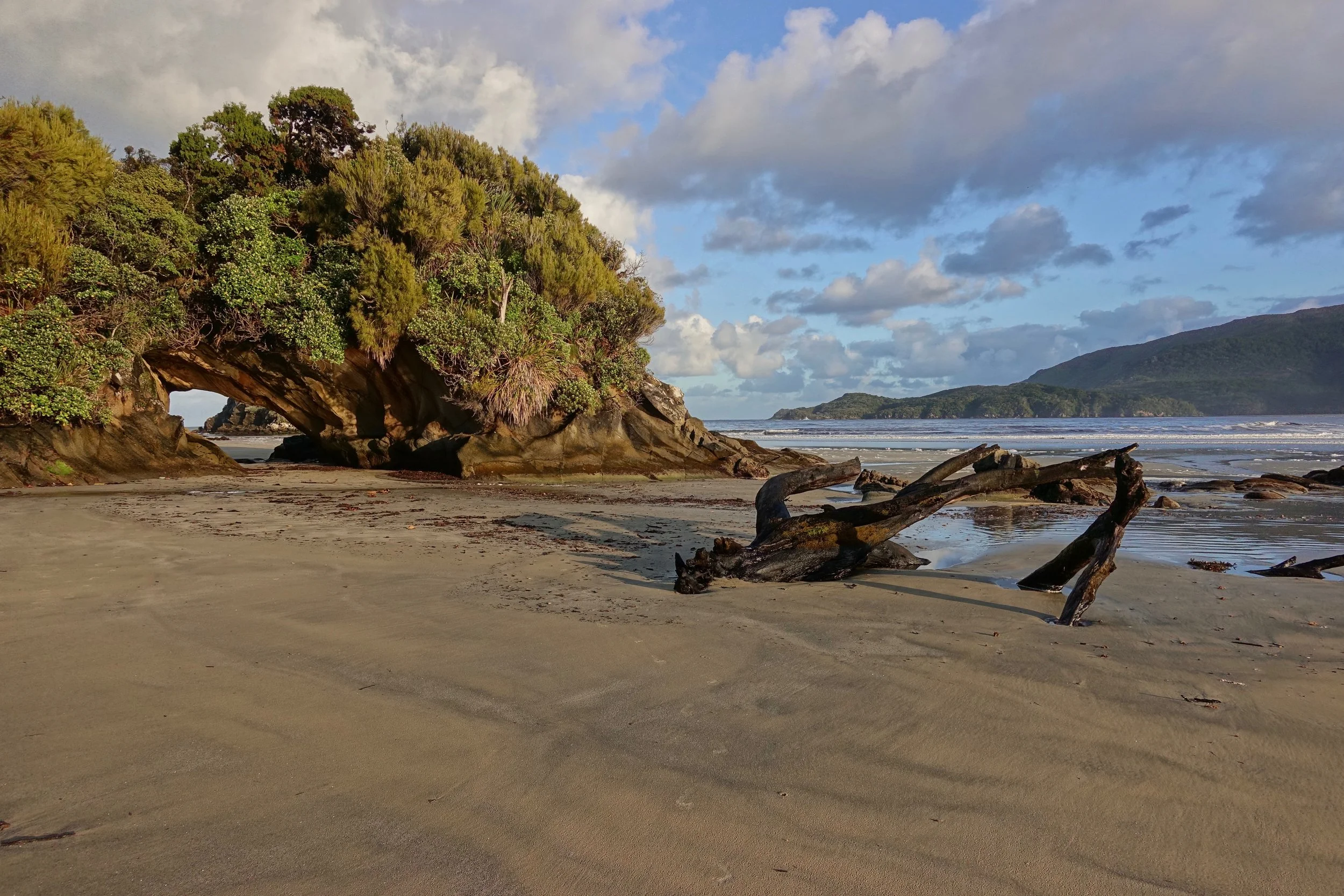 Arch on the beach at Doughboy Bay on Stewart Island in New Zealand