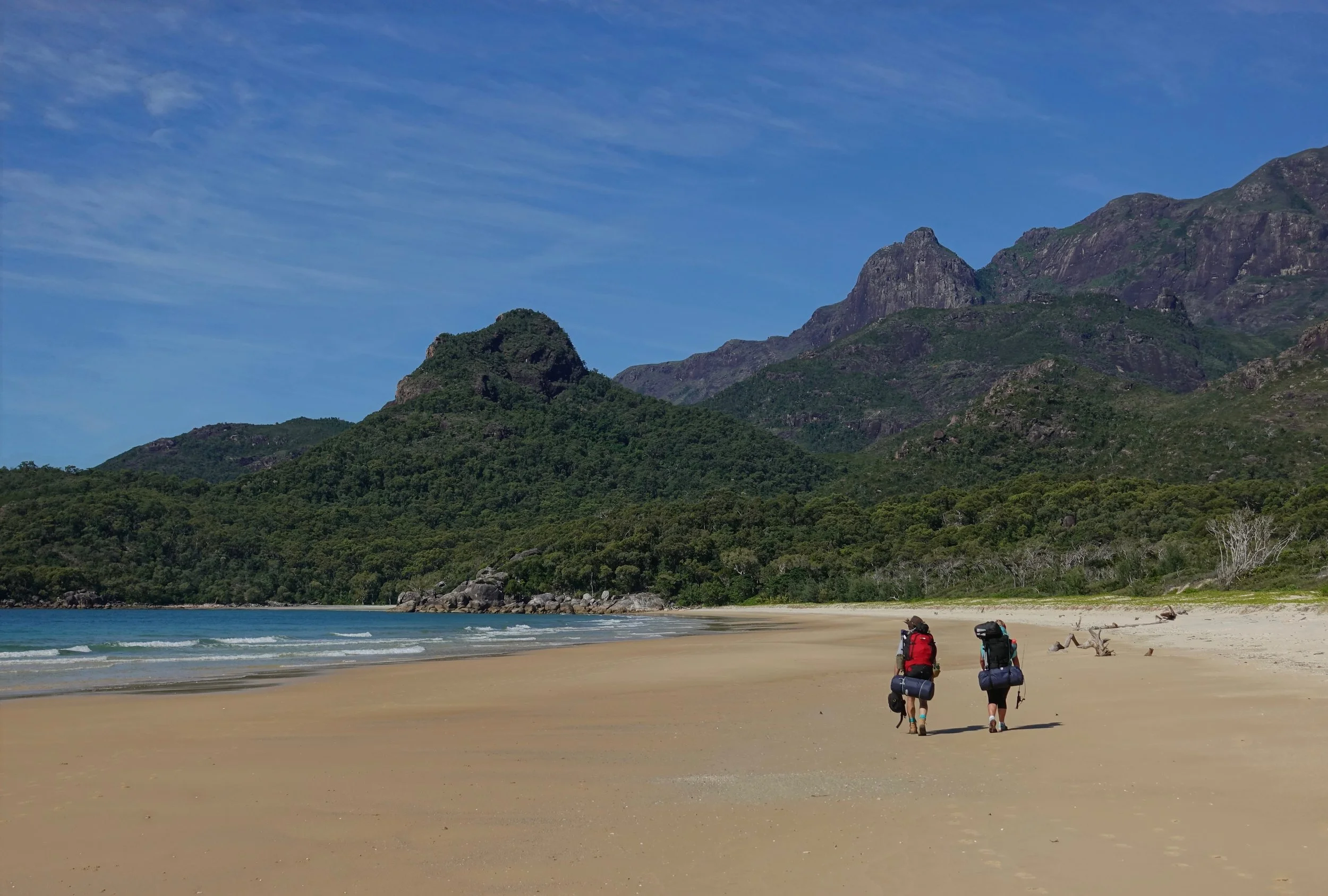 Trekking on the beach on the Thorsborne trail in Australia