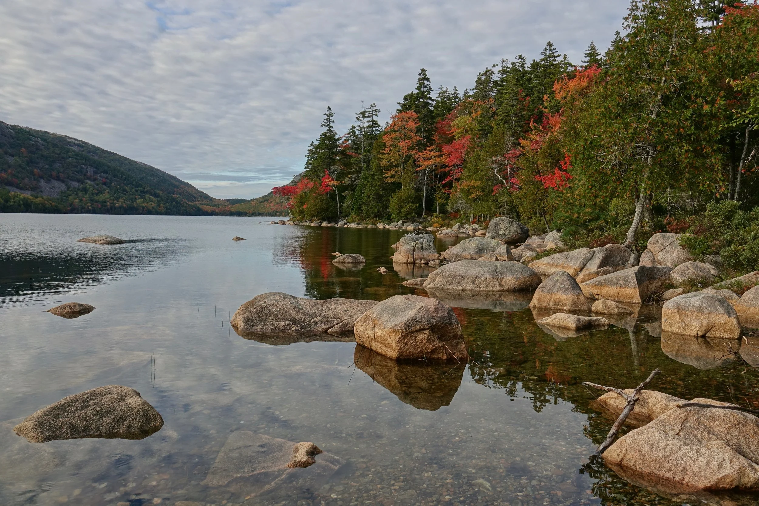 Walking alongside Jordan Pond in Acadia National Park Maine
