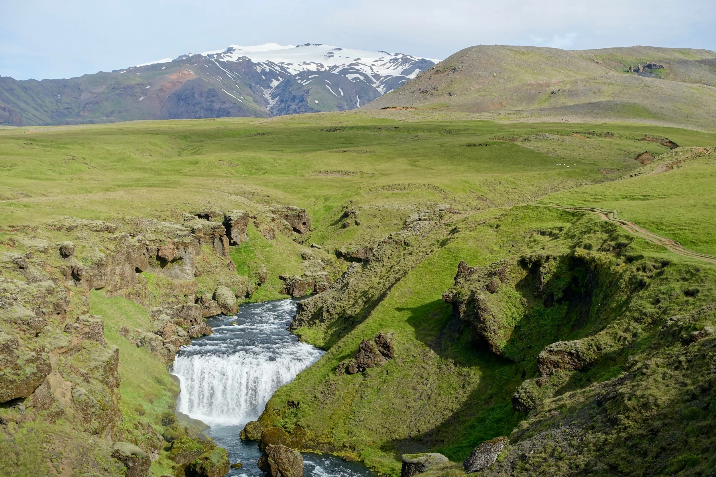 Volcano behind the waterfall on Fimmvorduhals hike in Iceland