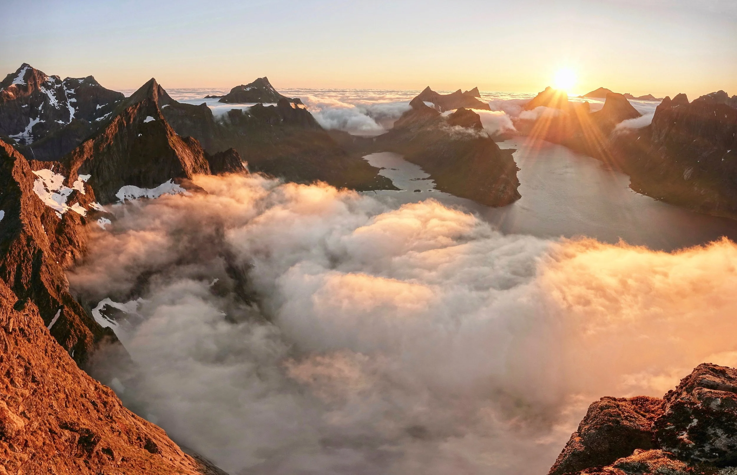 Midnight sun from Veinestind summit in Lofoten Norway in June
