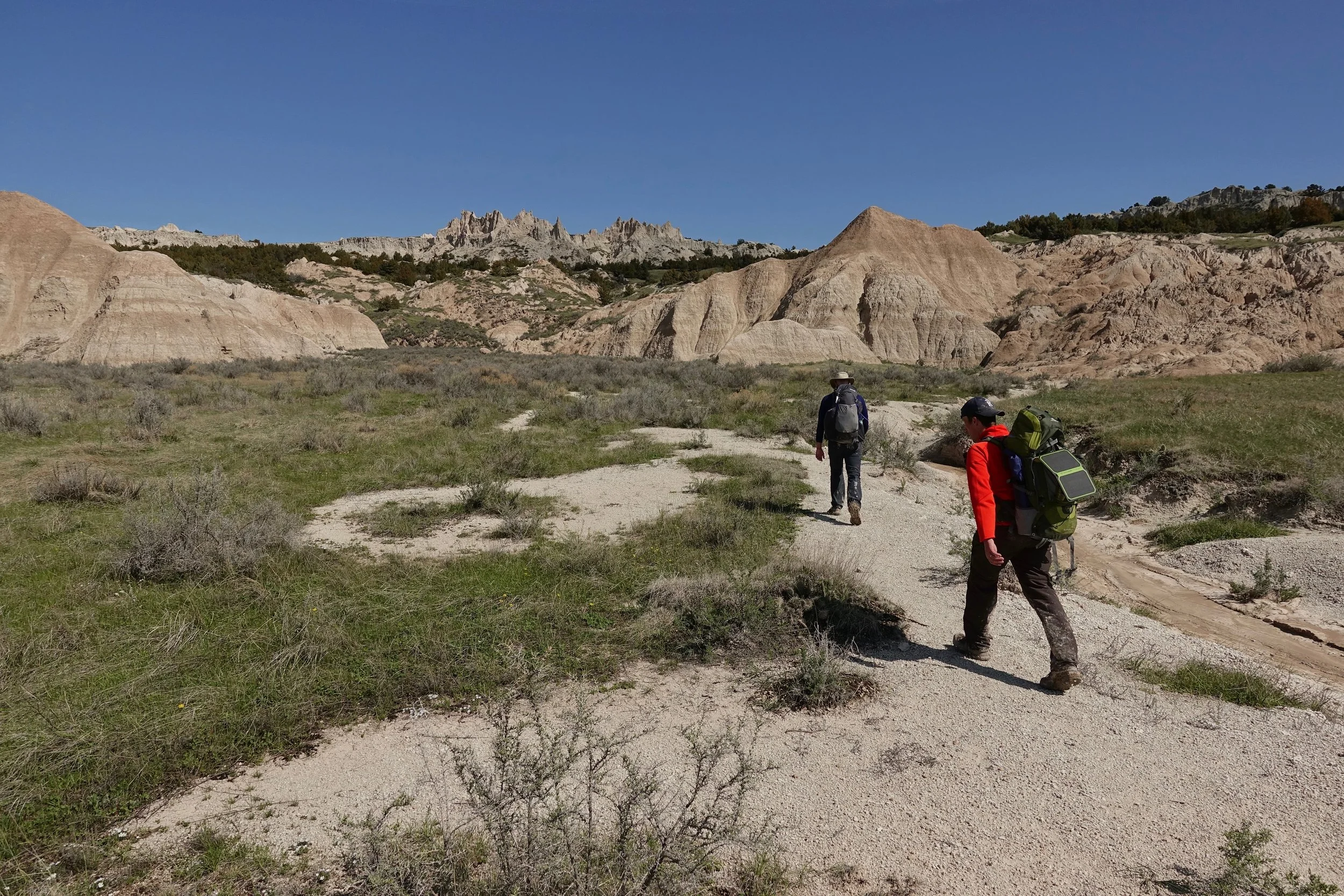 Matt and Scott hiking in front in Badlands backcountry hike