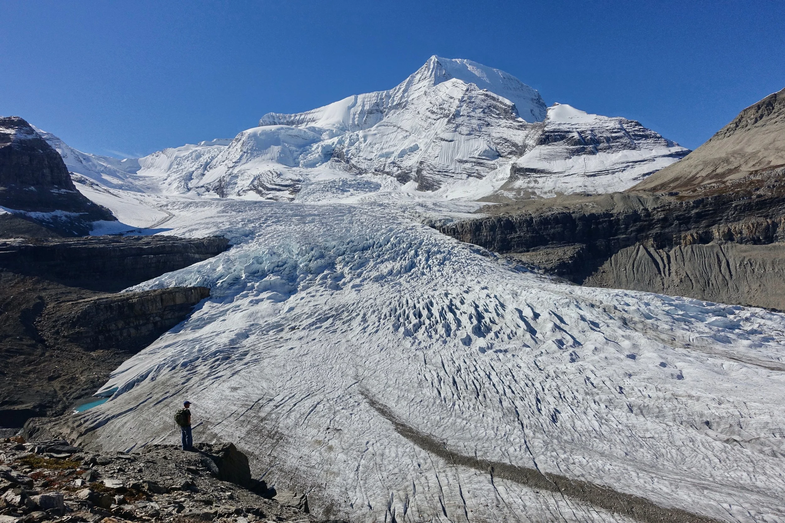 Hiker above Robson Glacier on Berg Lake Trail in Canada