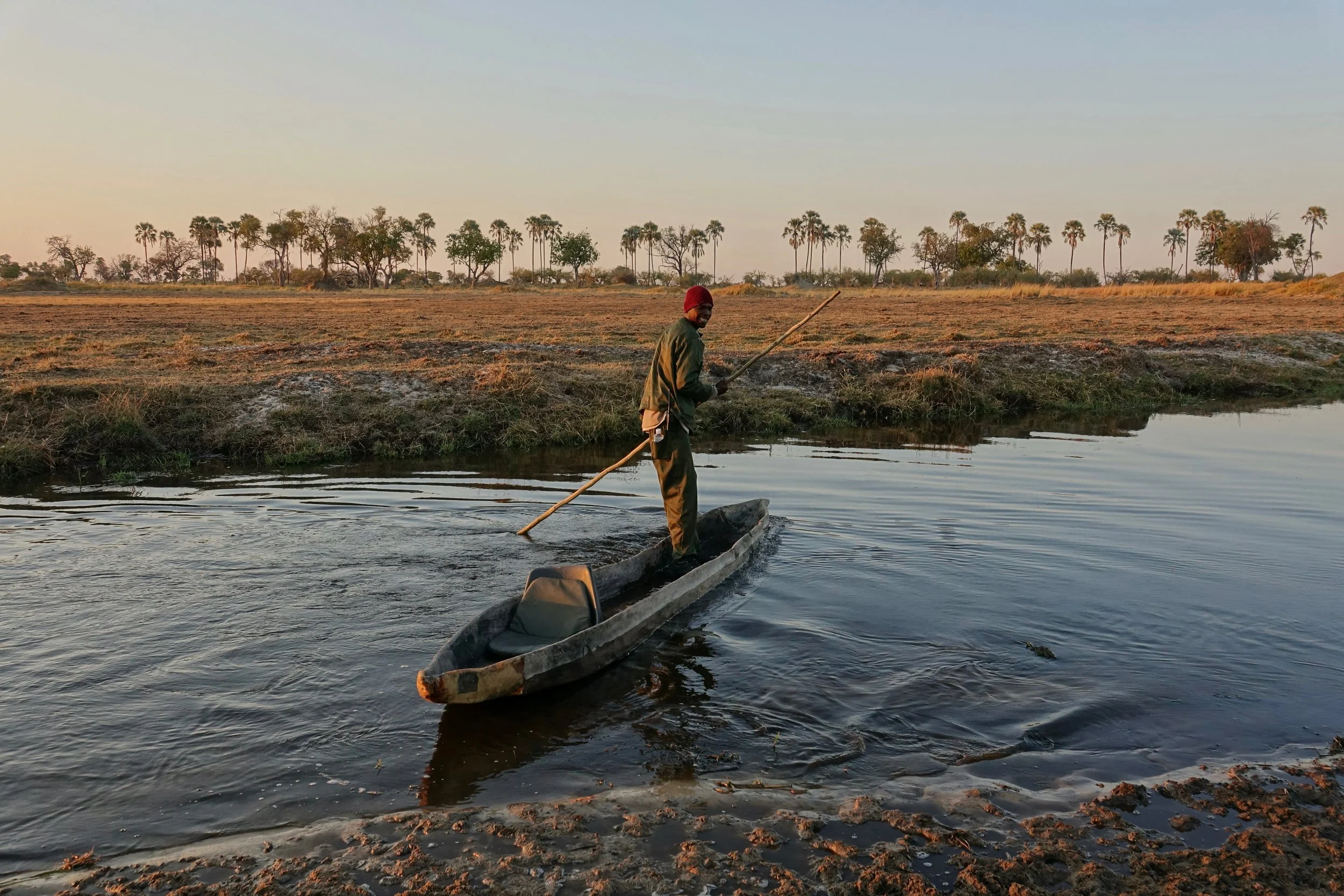 KG getting the mokoro ready for the day in the Oddball's camp in Okavango Delta