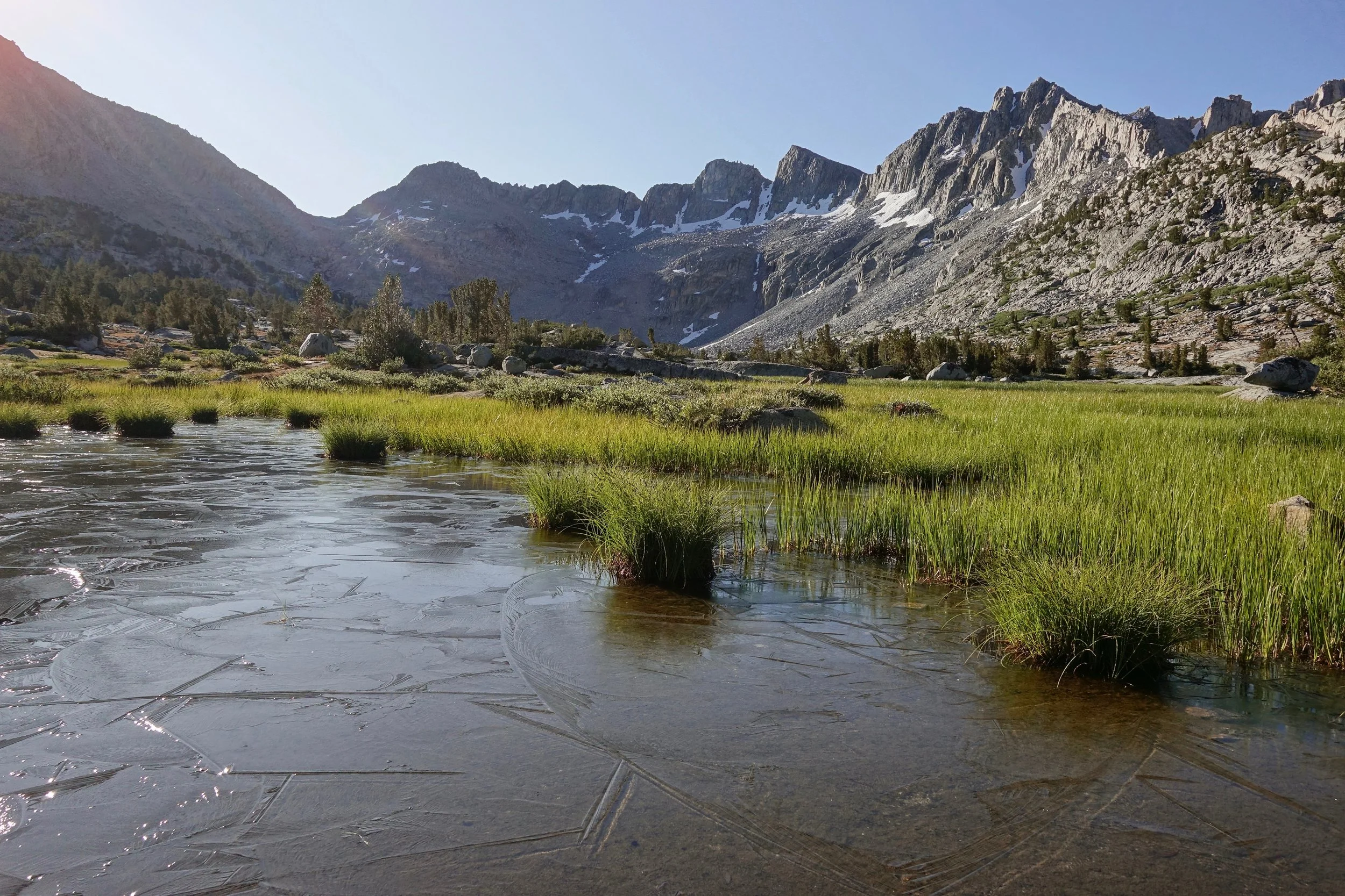 Frozen pond at Dusy basin near Bishop pass in the Sierra range