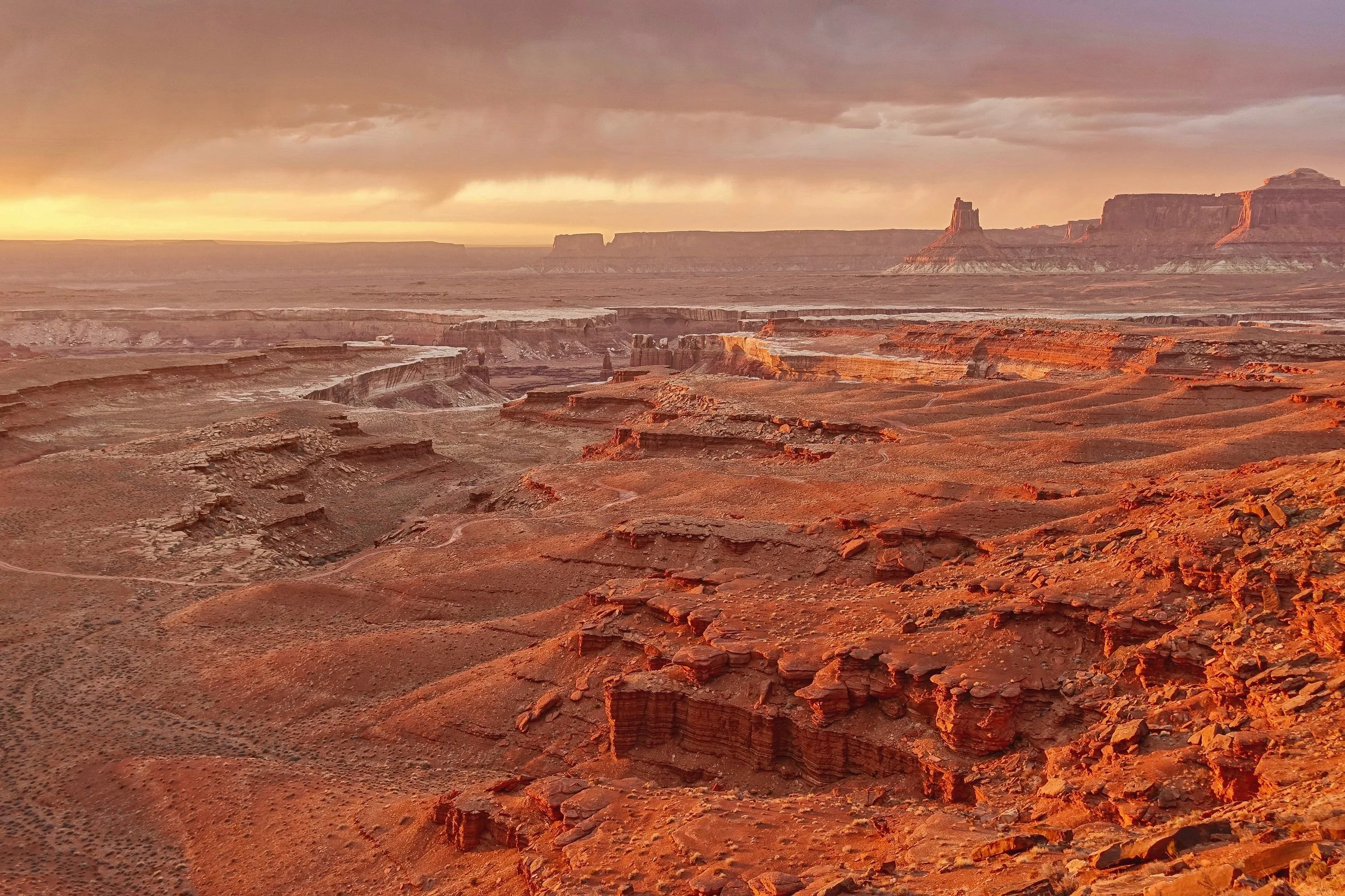 Sunset with Candlestick in the distance on the White Rim Trail in Canyonlands National park Utah