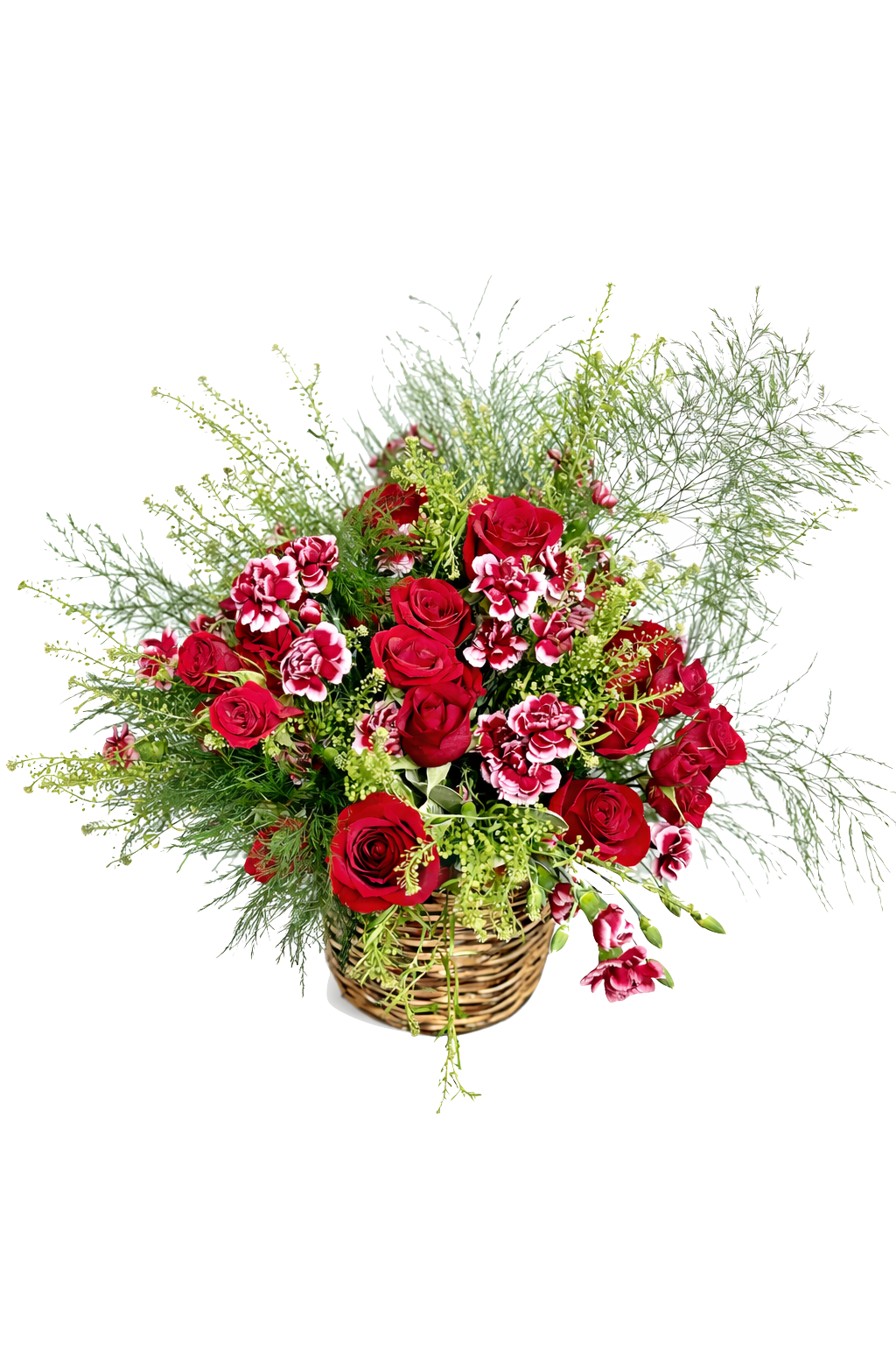 A red and pink based bouquet of mixed flowers in a wicker vase, featuring red, cream, and pink blooms with fluffy green leaves.