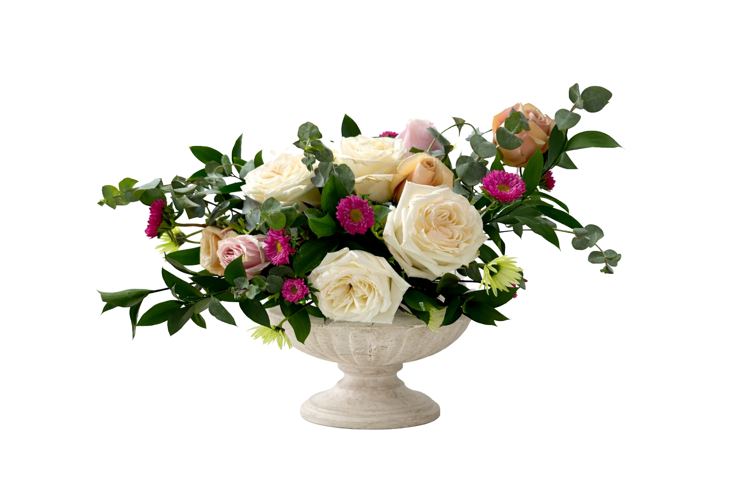 A floral arrangement in a decorative stone bowl, featuring white roses, pink and purple daisies, and greenery.