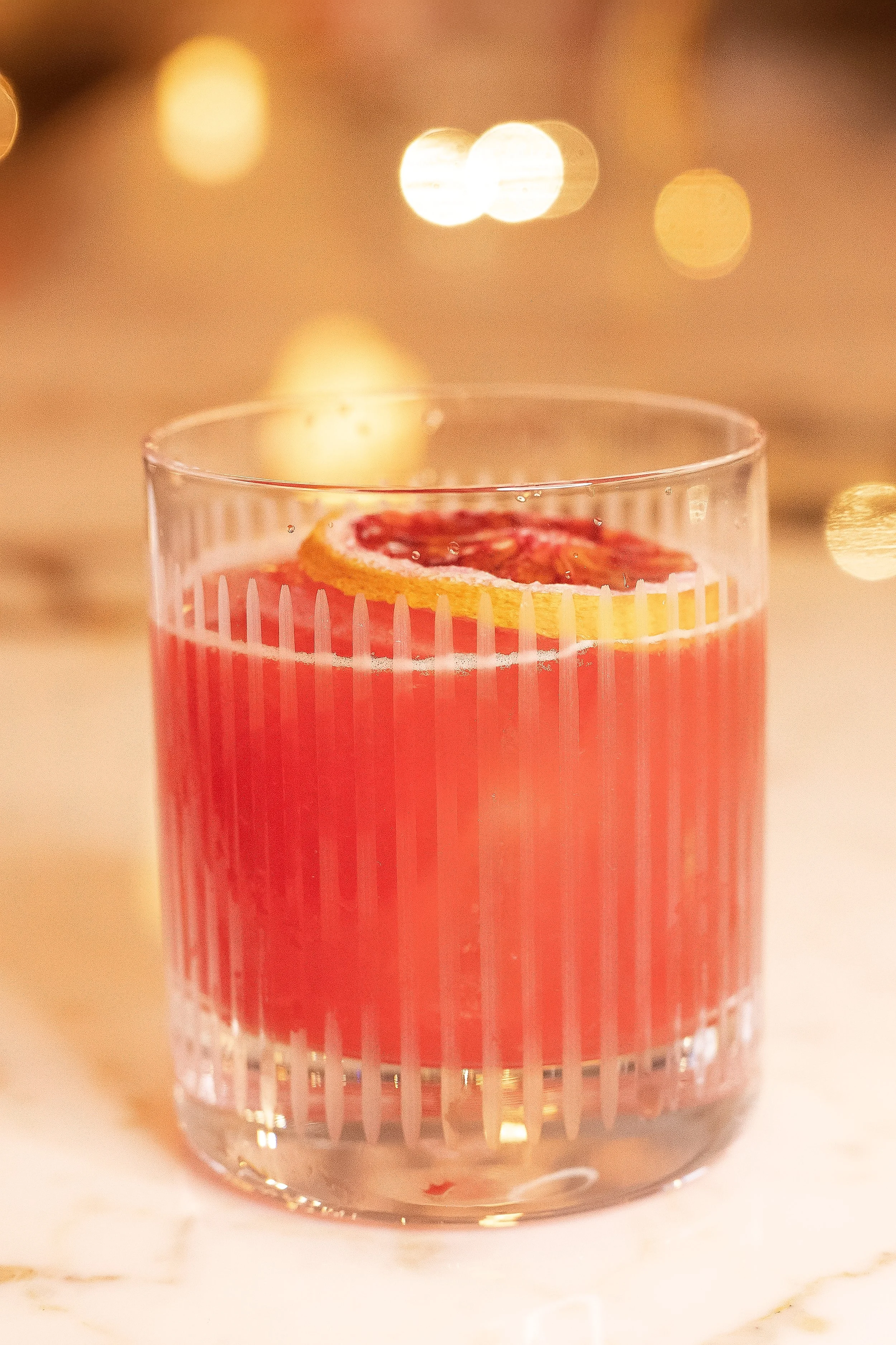 Refreshing citrus craft cocktail with a grapefruit garnish served at Viv & Jules Hoboken.