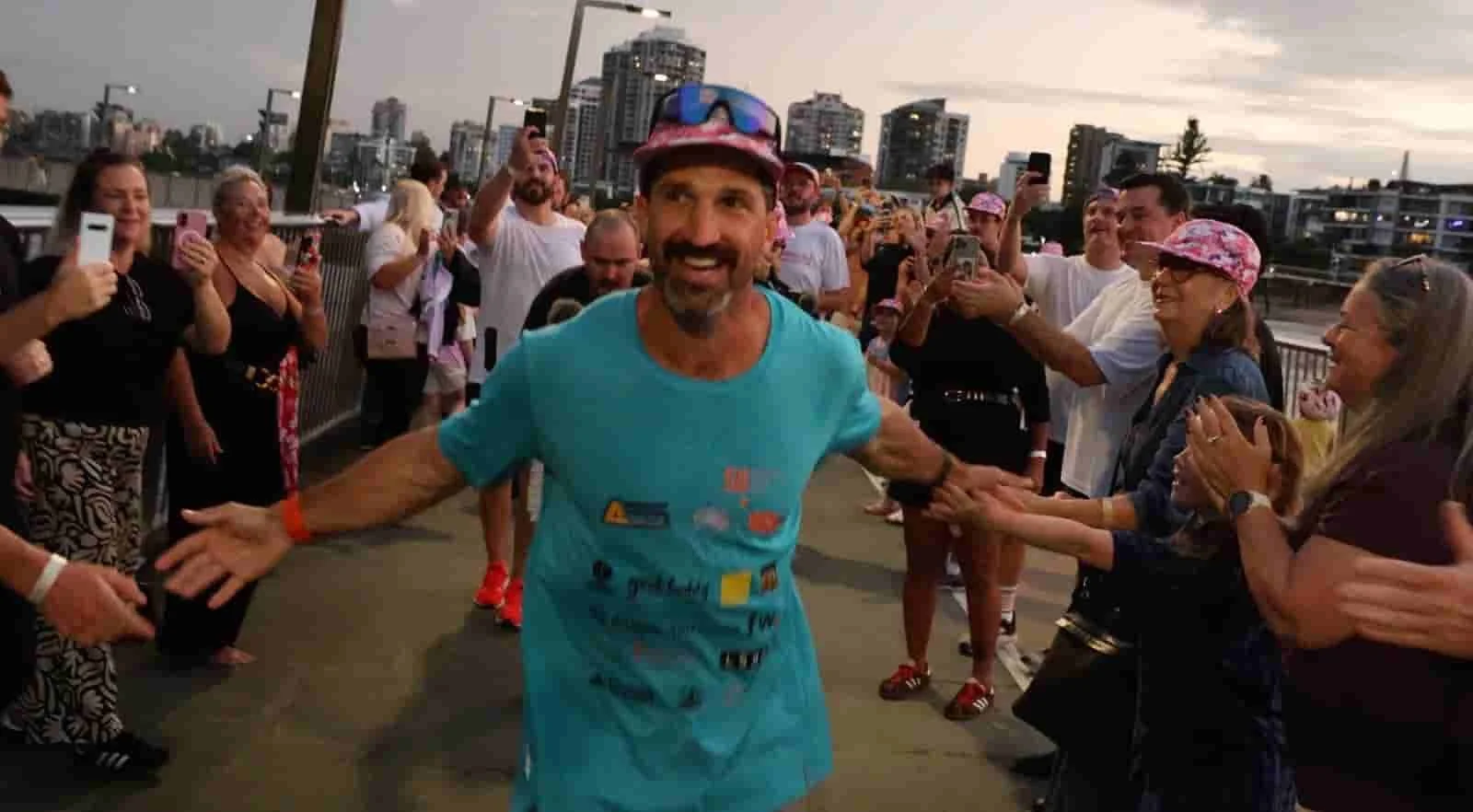 lachlan stuart finishing 58 marathons in Brisbane.jpeg