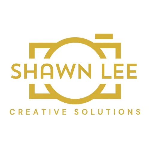 Logo for Shawn Lee Creative Solutions featuring a gold geometric design with the name in bold capital letters.