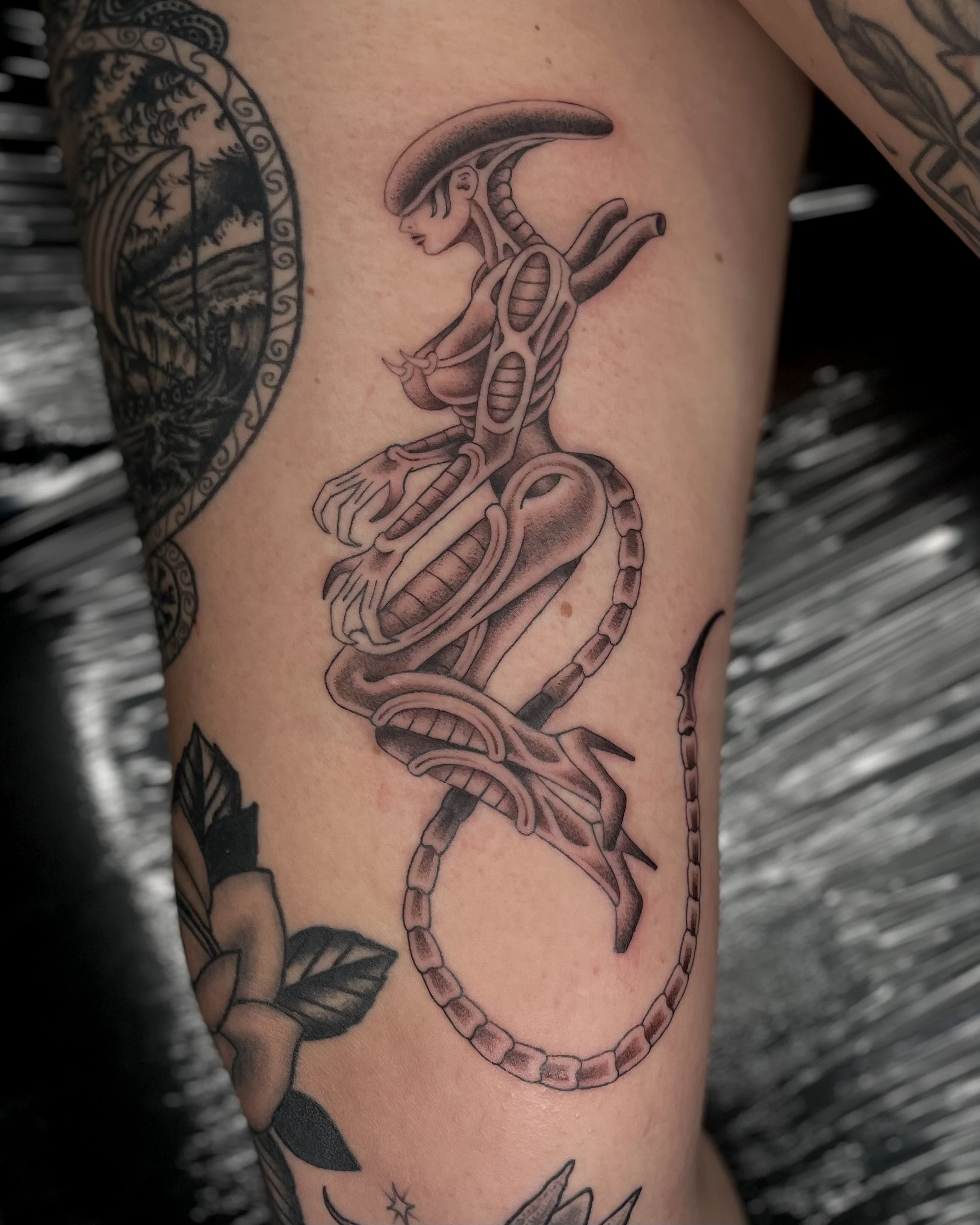 fineline xenomorph pinup girl tattoo